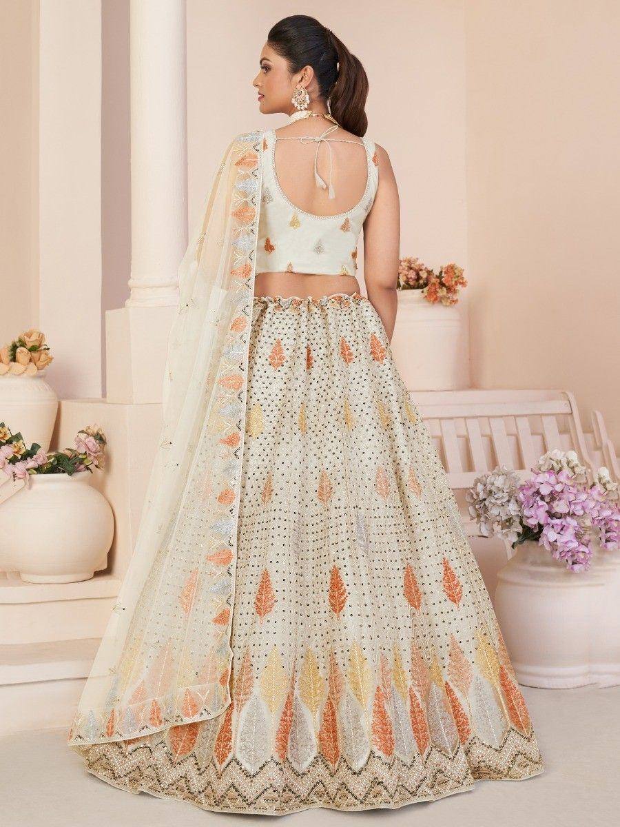 Elegant ivory lehenga choli with leaf embroidery and sheer dupatta, perfect for Indian ethnic occasions