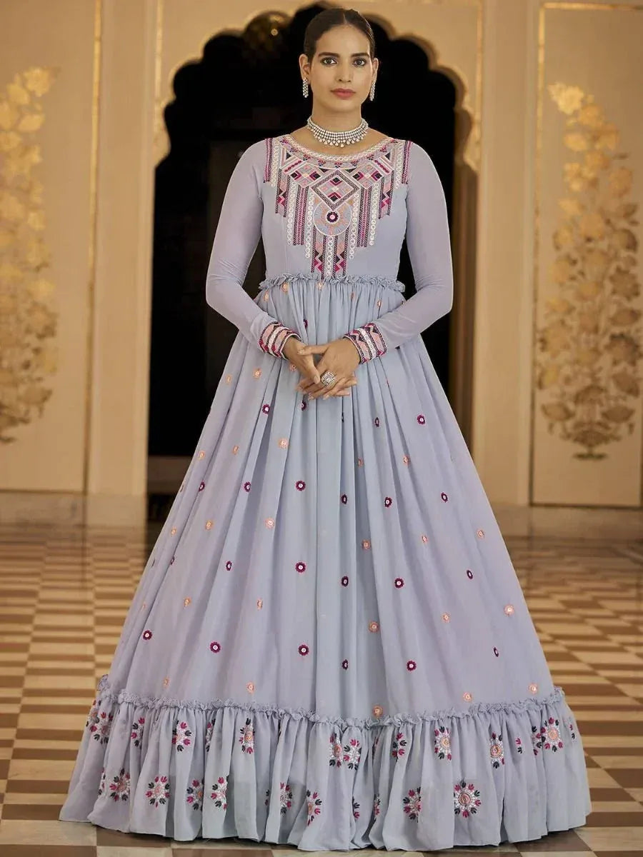 Lavender ethnic gown with intricate embroidery, perfect for Indian weddings and festive occasions.