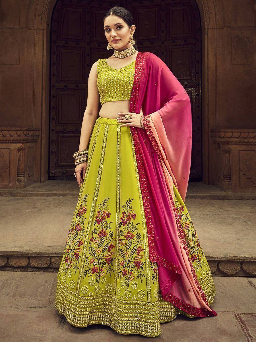 Vibrant yellow lehenga choli with floral embroidery and pink dupatta, perfect for Indian ethnic occasions.