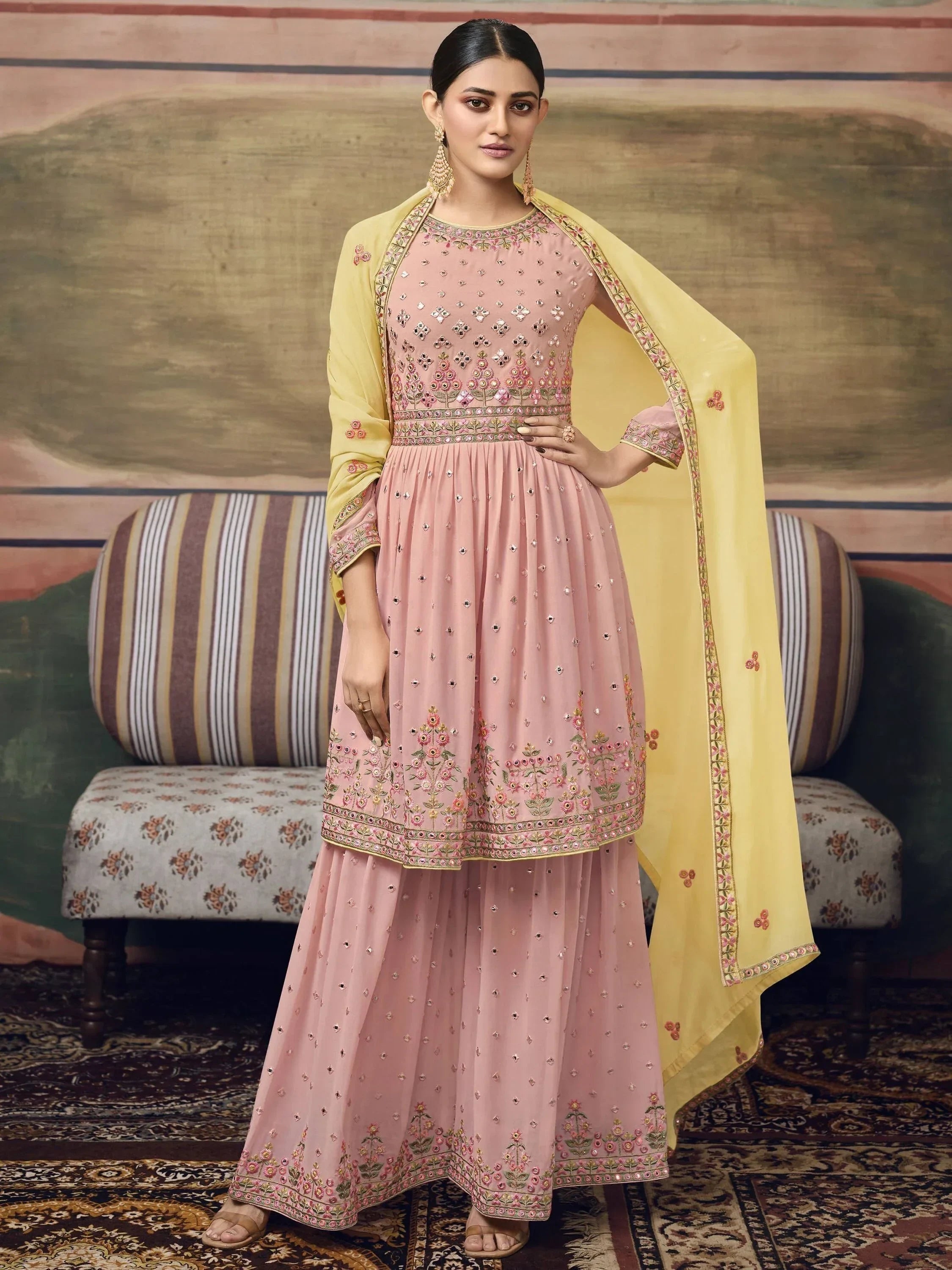 Woman in pink embroidered palazzo suit with floral dupatta, Indian ethnic wear