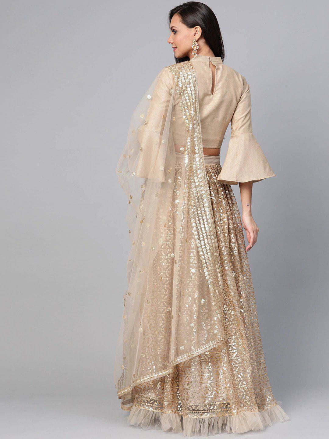 Beige sequin lehenga choli with bell sleeves and sheer dupatta, ethnic Indian wear for weddings