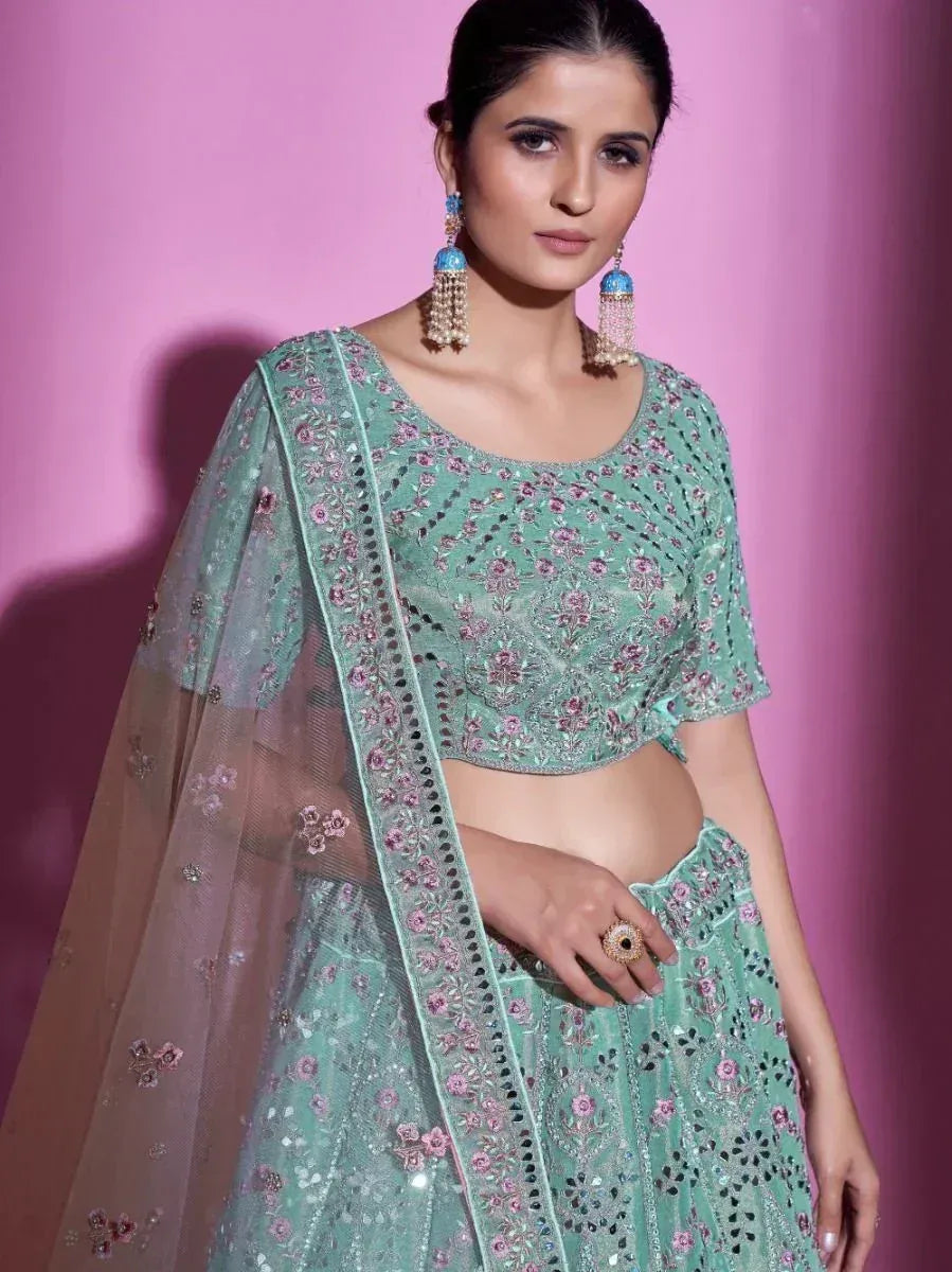 Mint green embroidered lehenga choli with floral motifs and sheer dupatta, perfect for Indian ethnic occasions