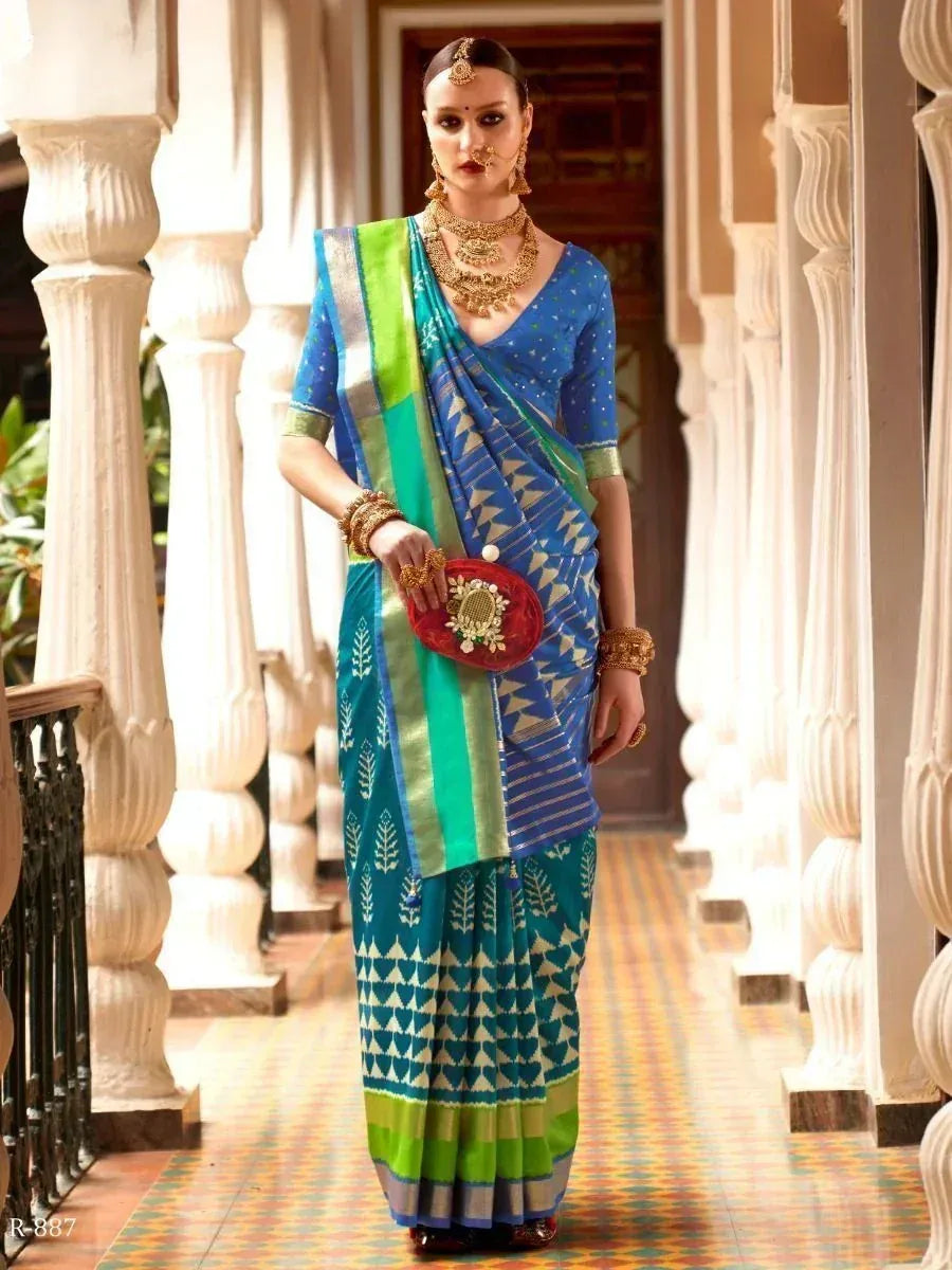 Blue and green printed saree with gold jewelry, perfect for Indian ethnic occasions