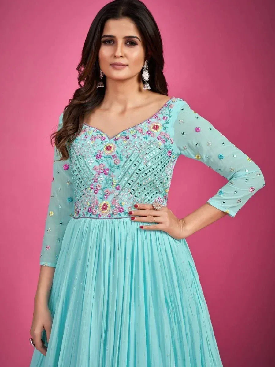 Light blue embroidered ethnic gown with floral detailing, perfect for Indian occasions and parties.