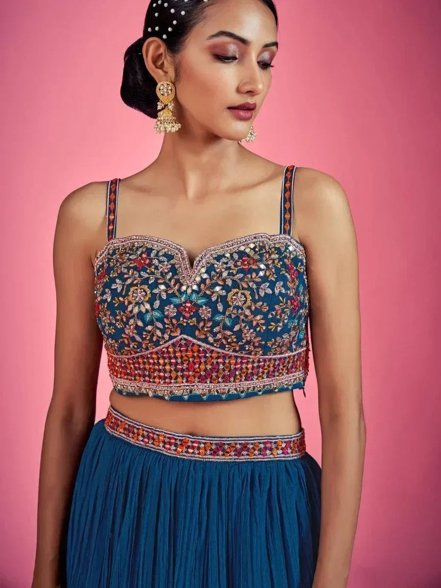 Blue embroidered lehenga choli with floral mirror work, perfect for Indian ethnic wear occasions