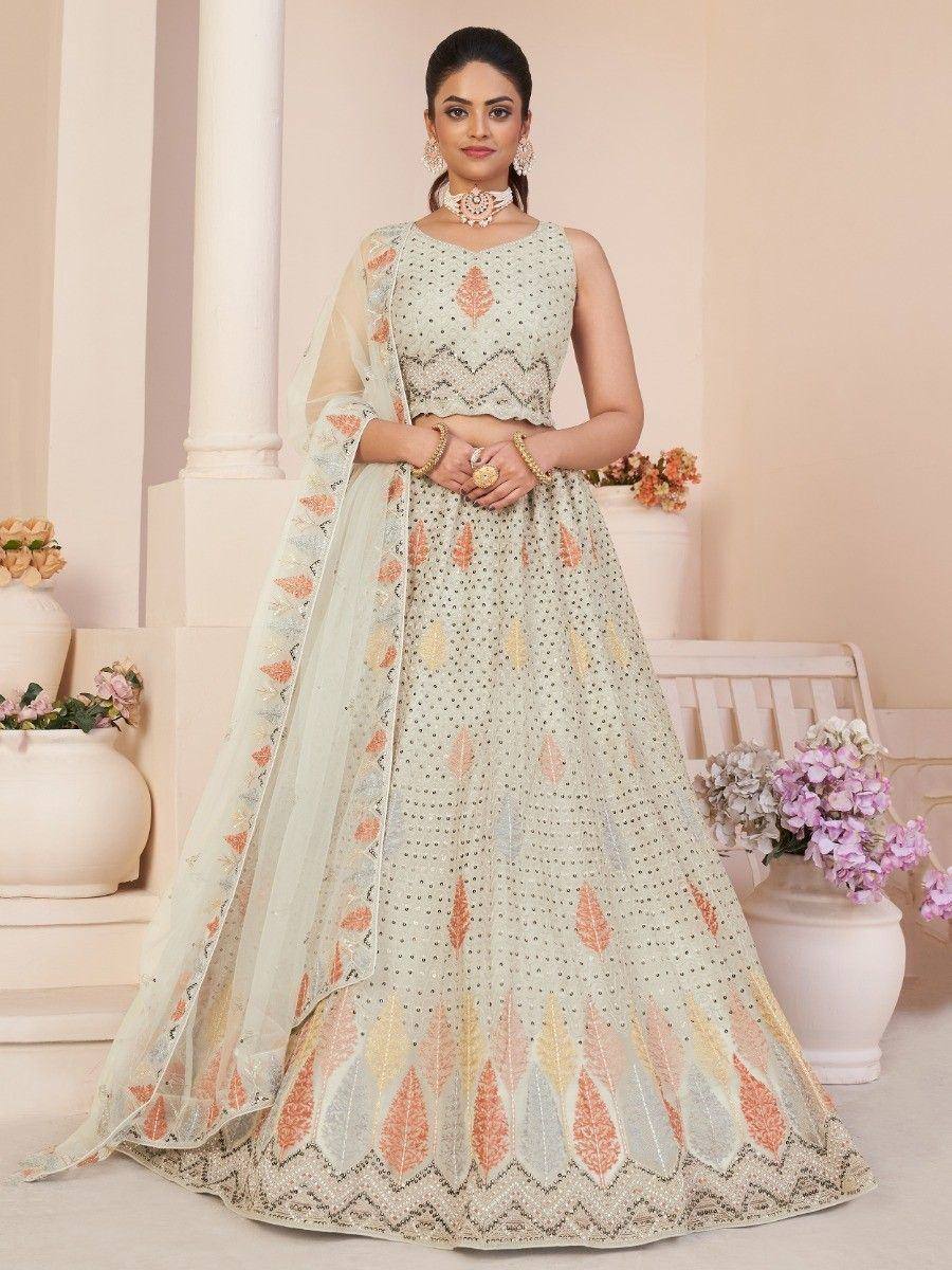 Elegant pastel lehenga choli with floral embroidery, perfect for Indian weddings and festive occasions.