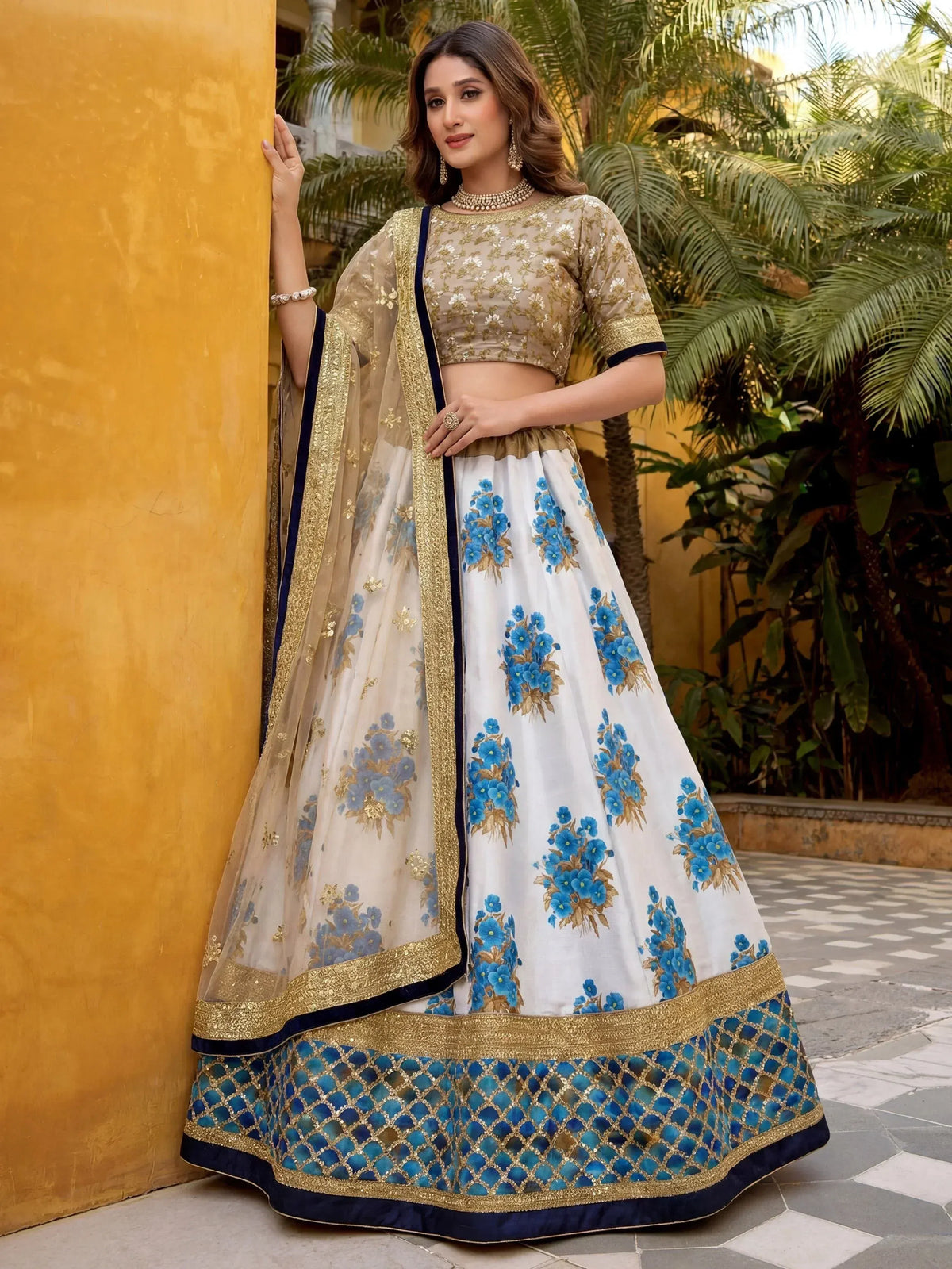White and blue floral lehenga choli with gold embroidery, perfect for Indian ethnic wear occasions