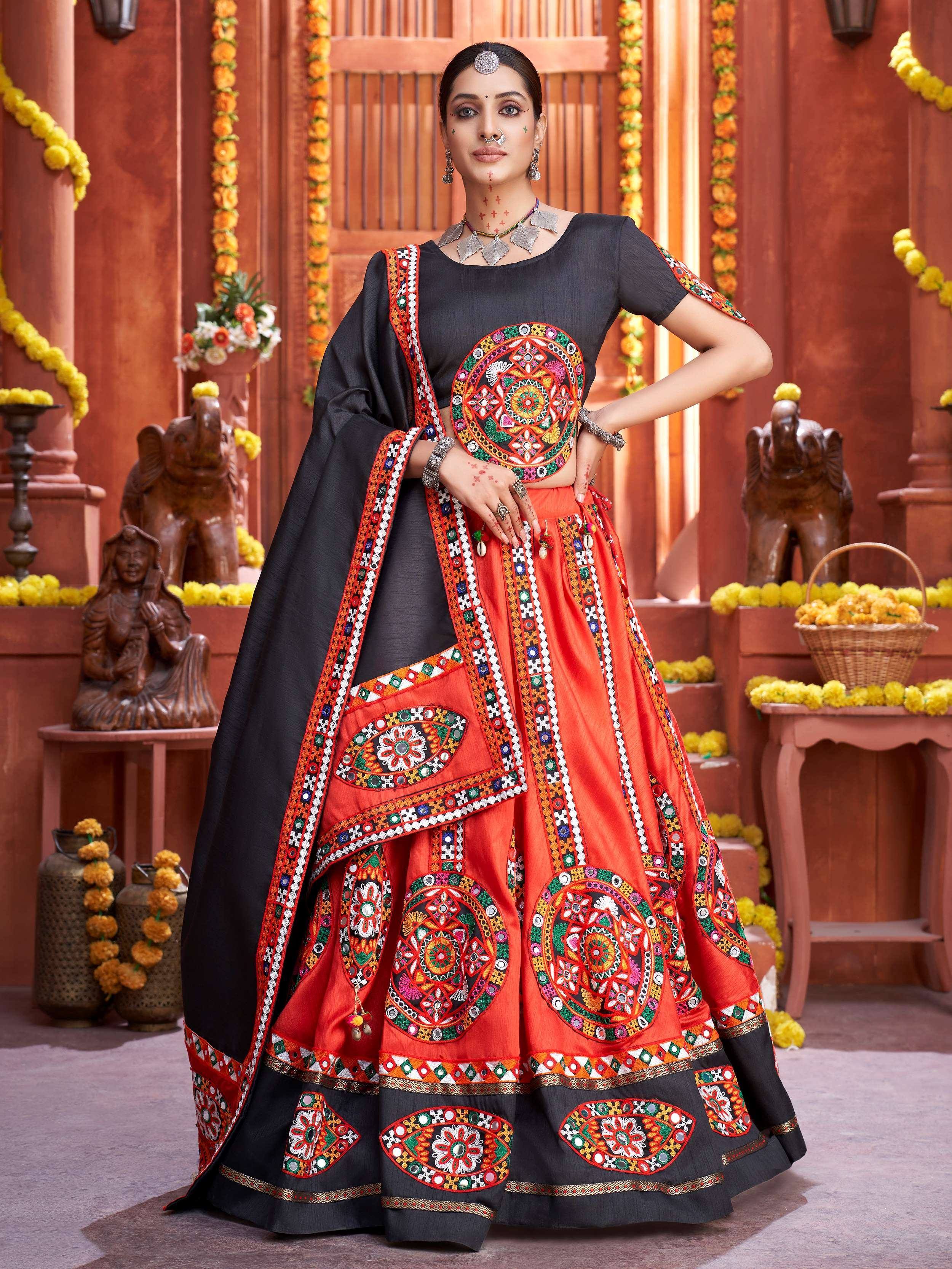 Black and orange embroidered lehenga choli with mirror work, perfect for Indian ethnic wear occasions