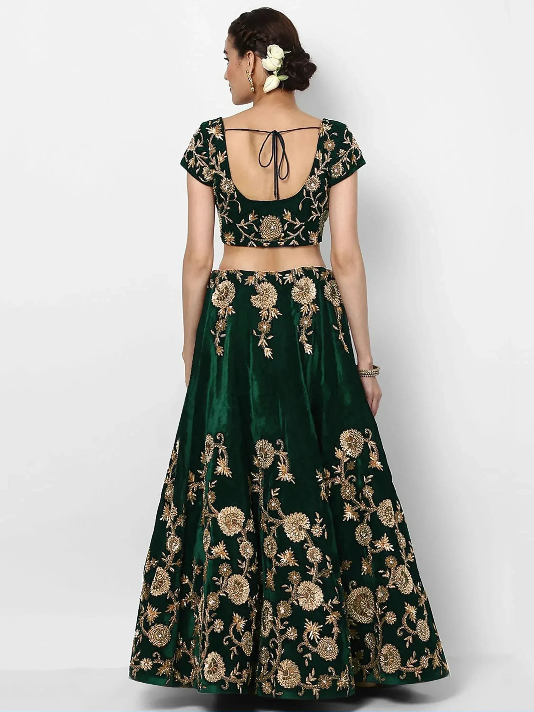 Emerald green velvet lehenga choli with gold floral embroidery, back view with tie-up blouse