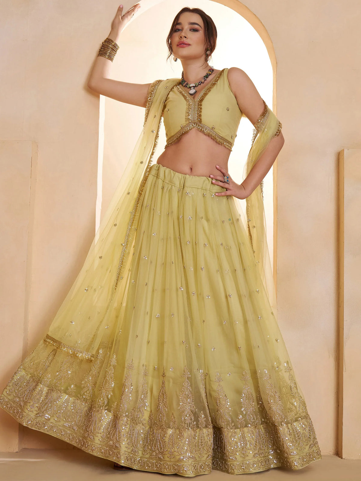 Wonderful Pastel Yellow Embroidered Net Haldi Wear Lehenga Choli