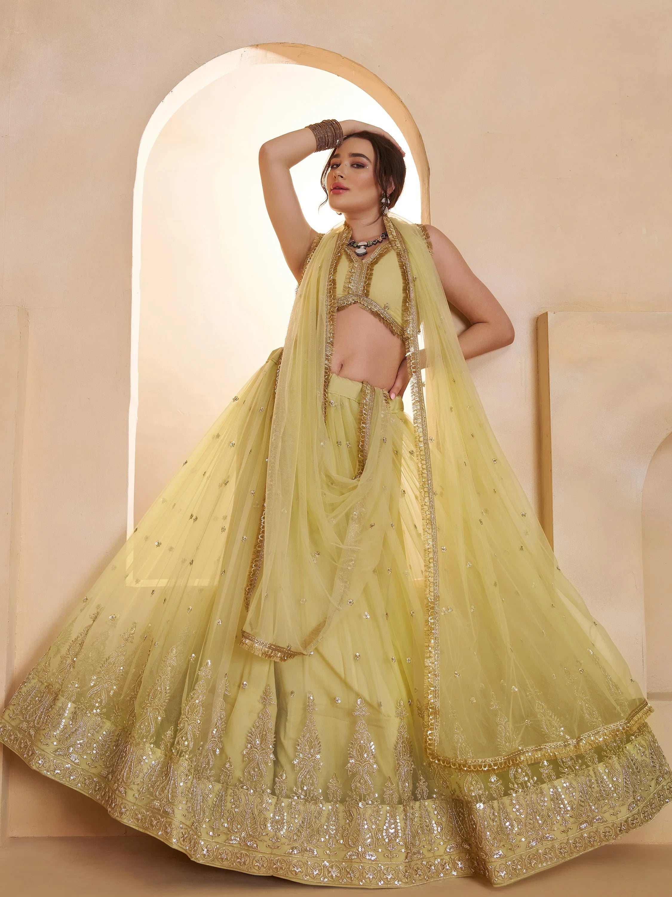 Wonderful Pastel Yellow Embroidered Net Haldi Wear Lehenga Choli