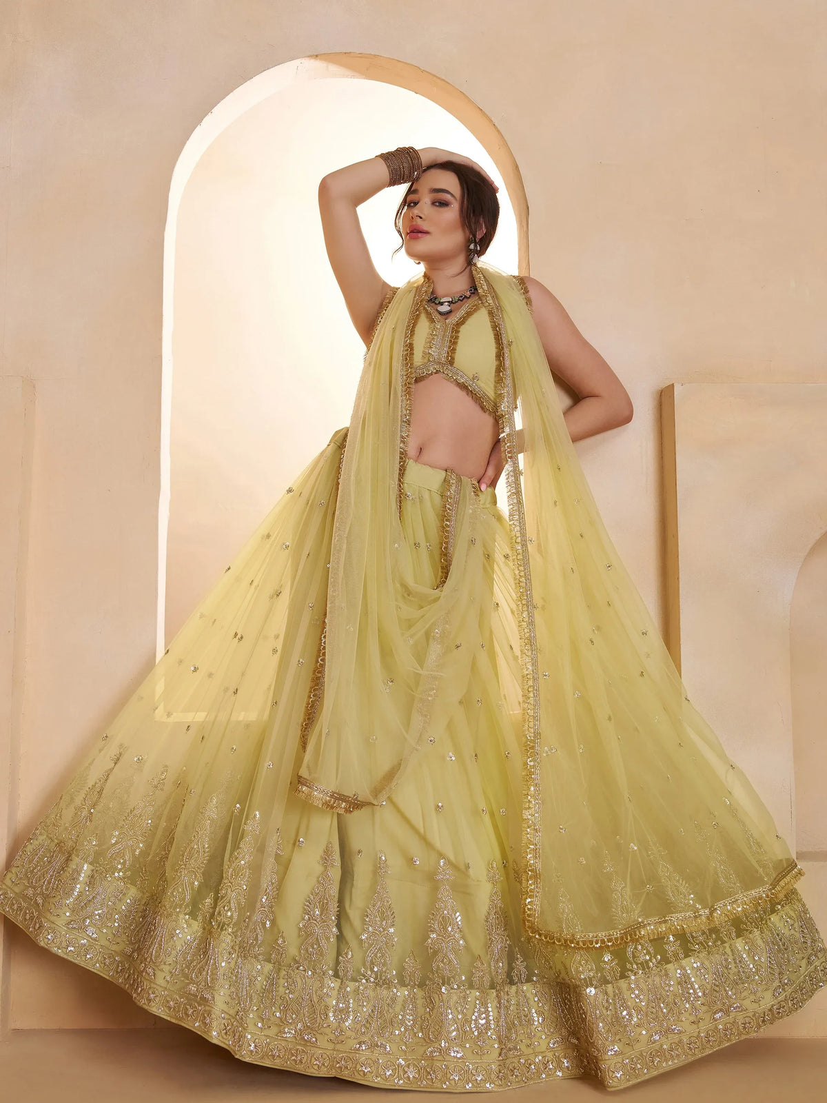 Wonderful Pastel Yellow Embroidered Net Haldi Wear Lehenga Choli