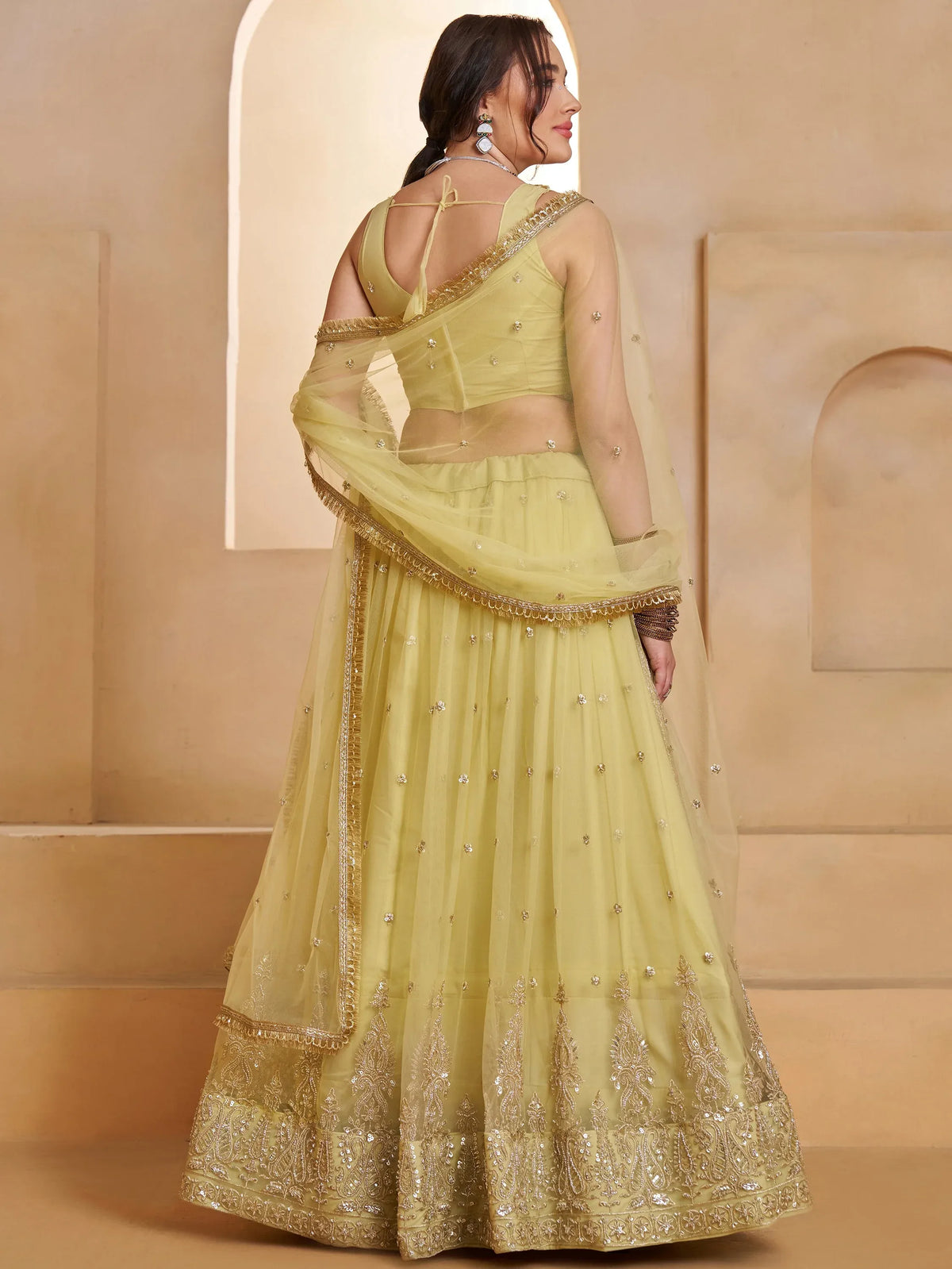 Wonderful Pastel Yellow Embroidered Net Haldi Wear Lehenga Choli