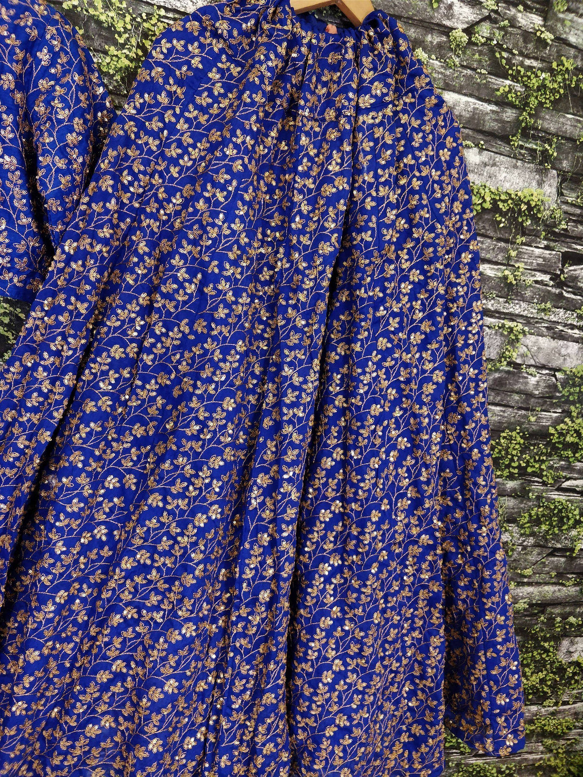 Royal blue ethnic gown with gold floral embroidery and sequins, perfect for Indian occasions