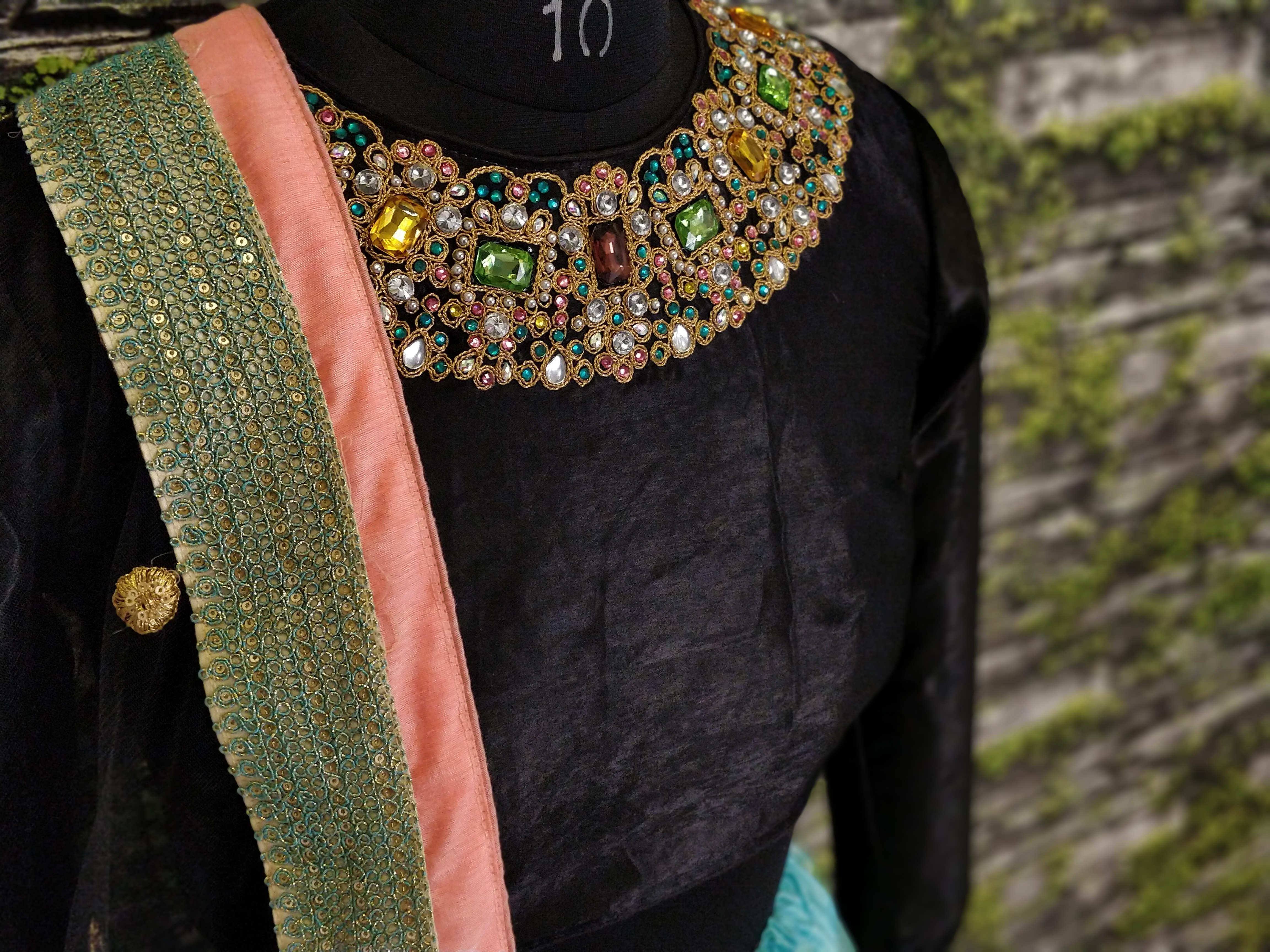 Black velvet ethnic top with heavy multicolor stone embroidery and green sequin dupatta