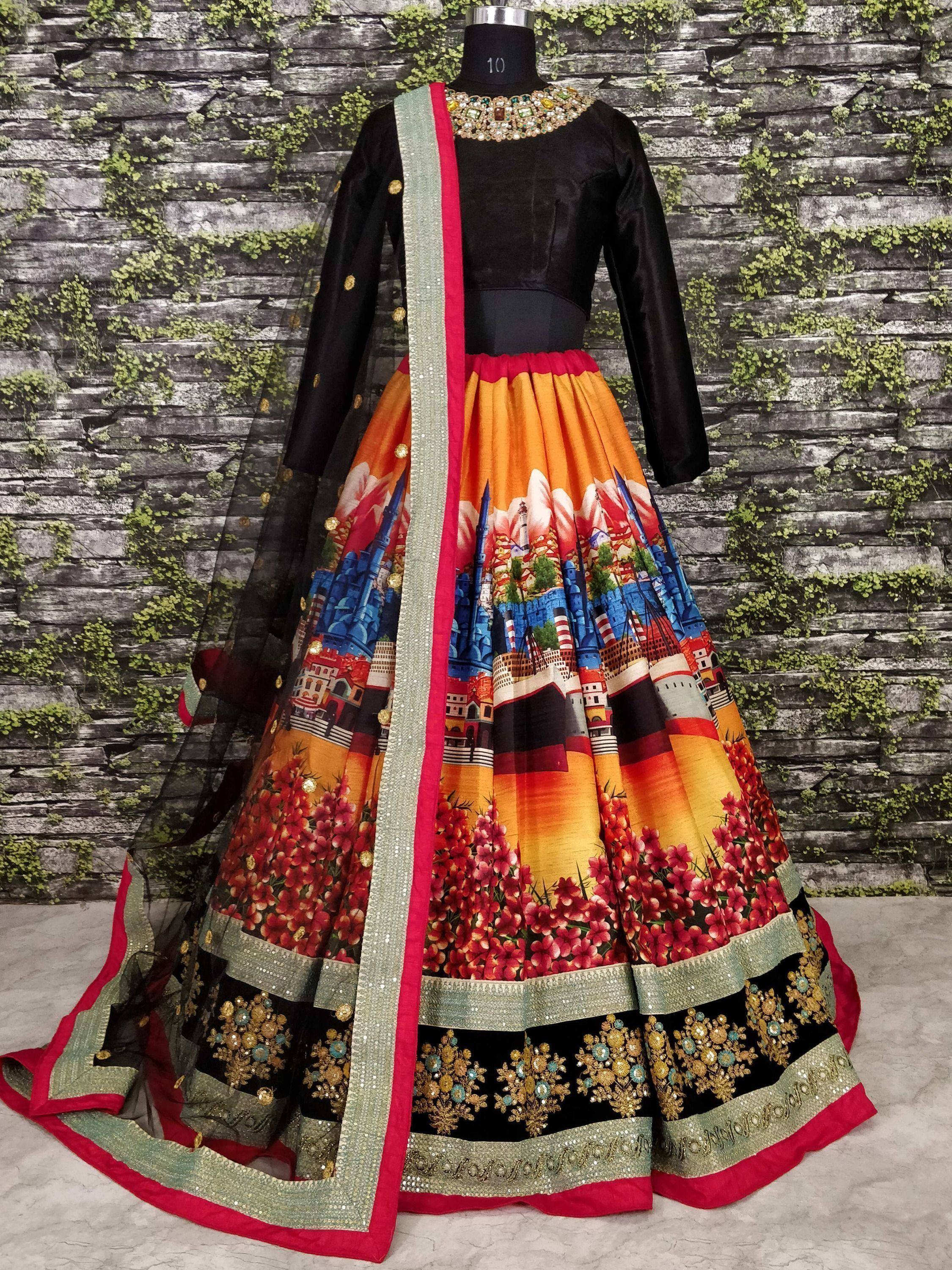 Black velvet designer lehenga with colorful cityscape print, floral border, and sequin dupatta for ethnic wear