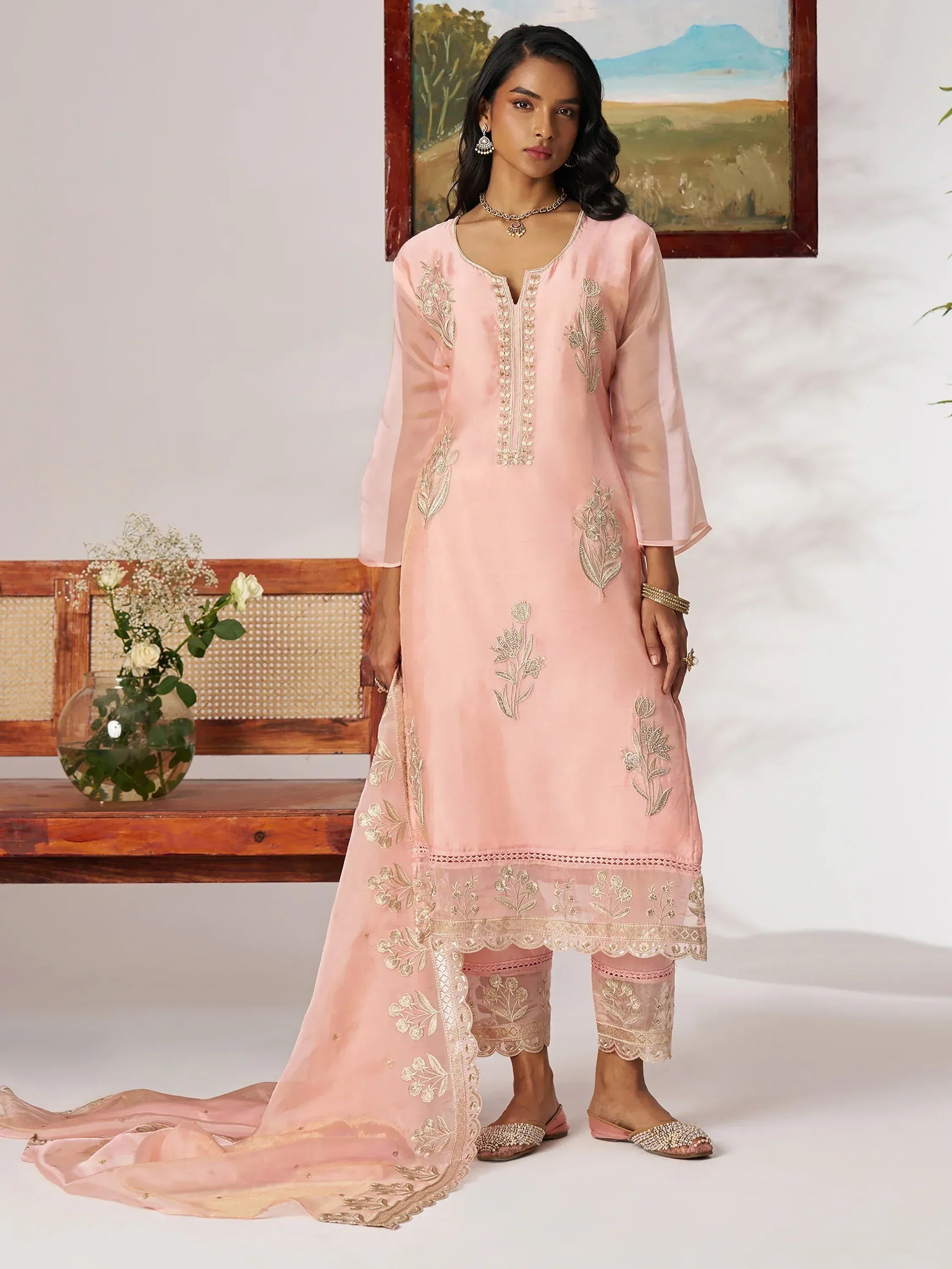 Pink embroidered salwar kameez with floral detailing and matching dupatta, ideal for ethnic occasions.