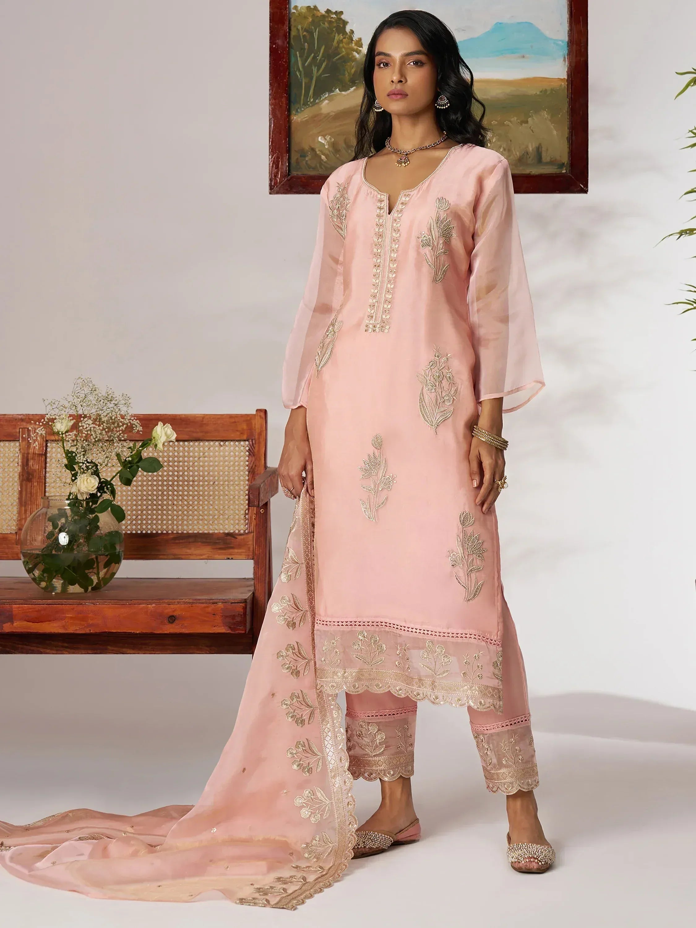 Pink embroidered salwar kameez with floral detailing, perfect for Indian ethnic wear occasions