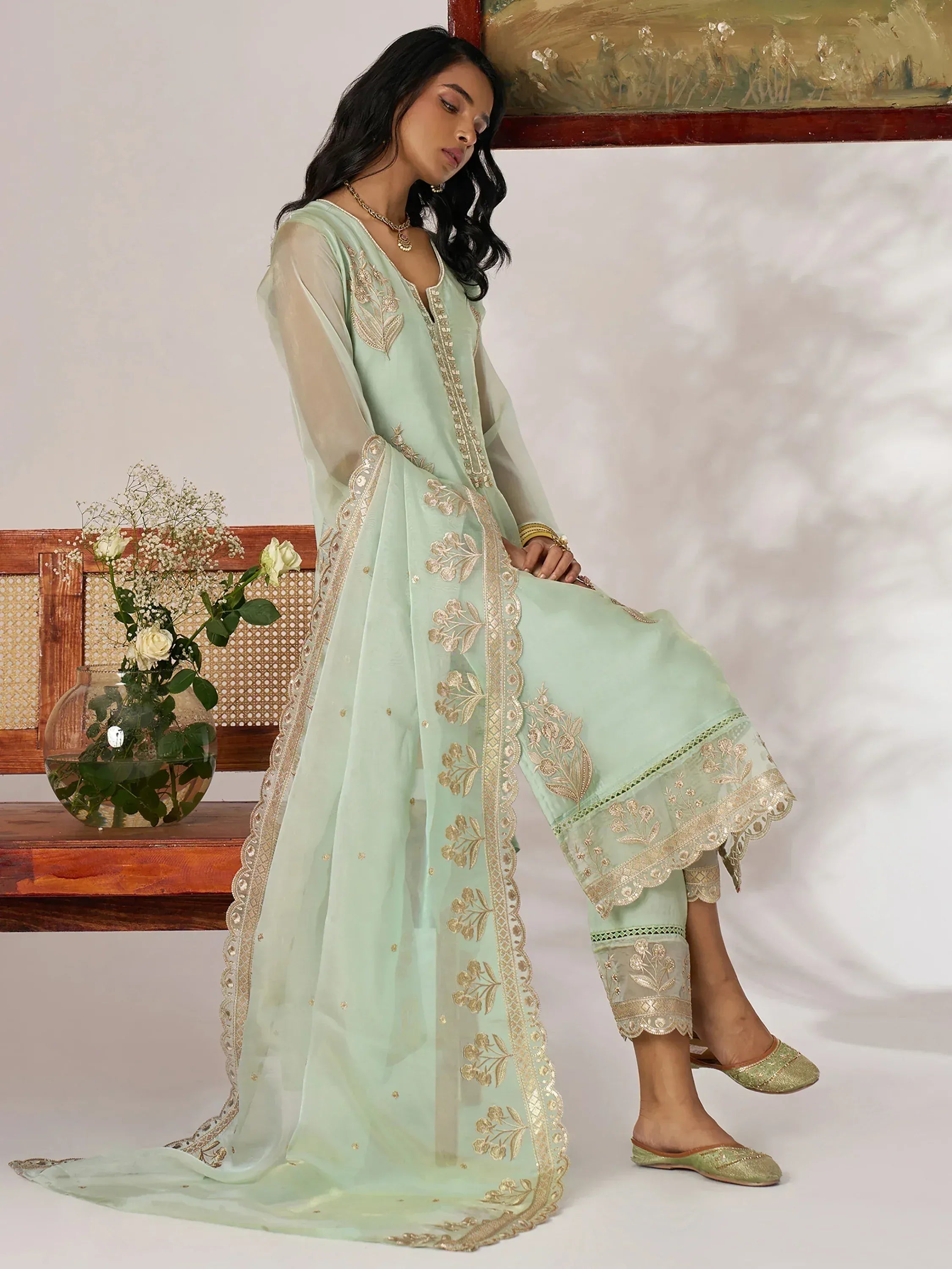 Mint green embroidered salwar kameez with gold detailing, perfect for ethnic occasions