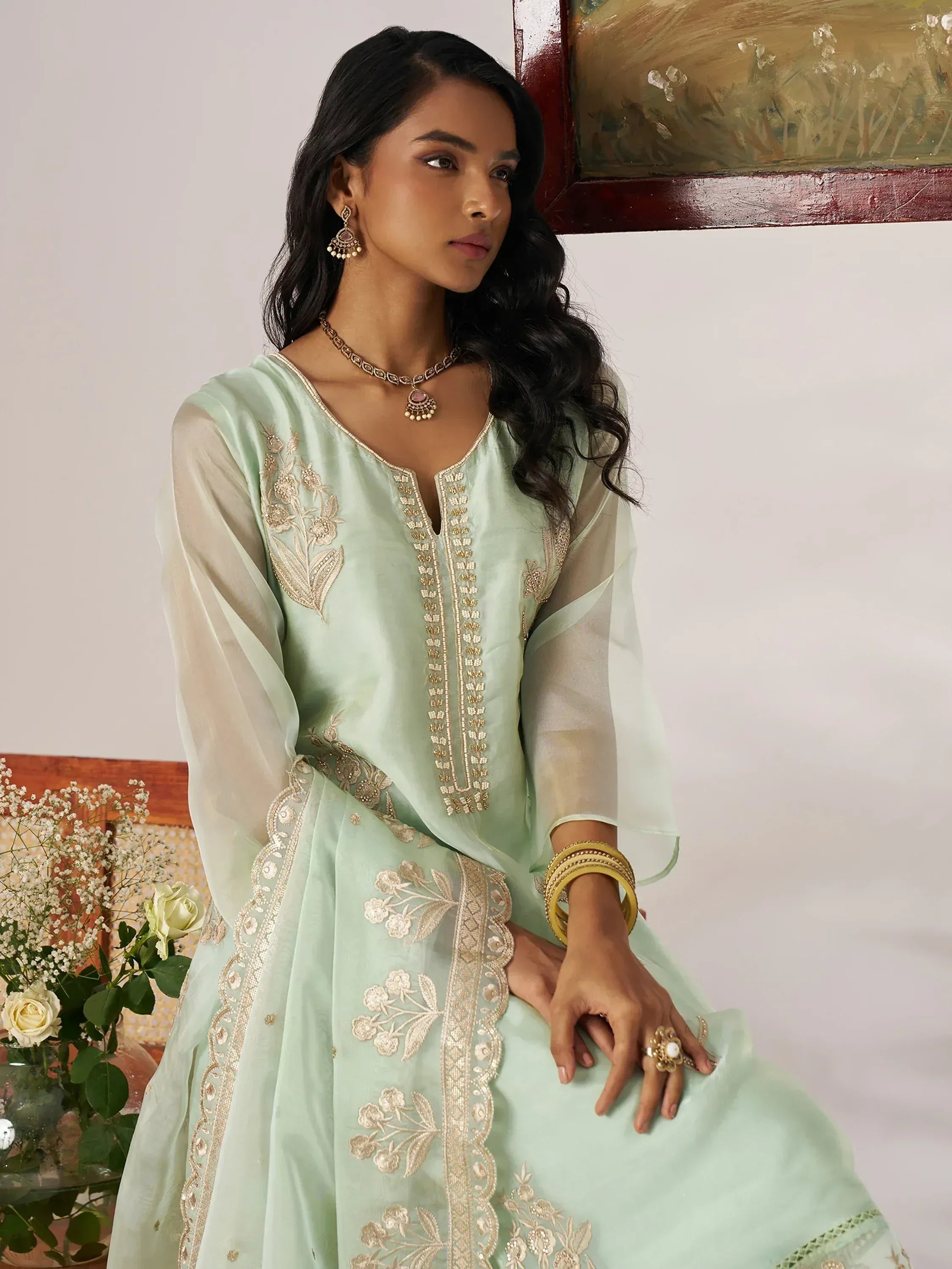 Mint green embroidered salwar kameez with gold detailing, perfect for Indian ethnic wear occasions.