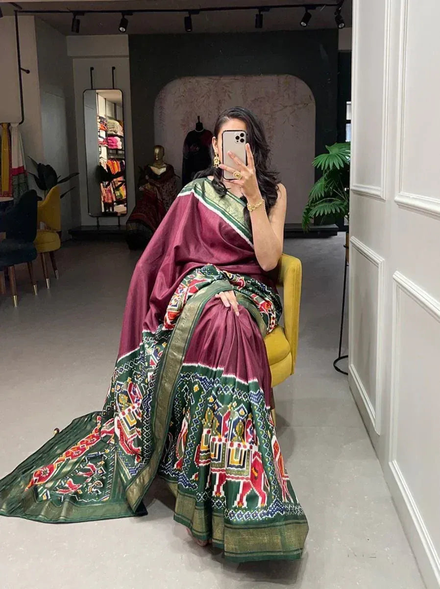 Enchanting Maroon Patola Printed Dola Silk Festival Wear Saree