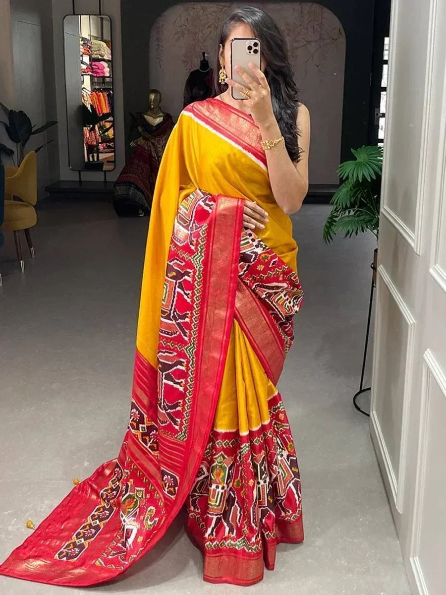 Vibrant yellow and red printed saree with intricate border, perfect for Indian ethnic wear