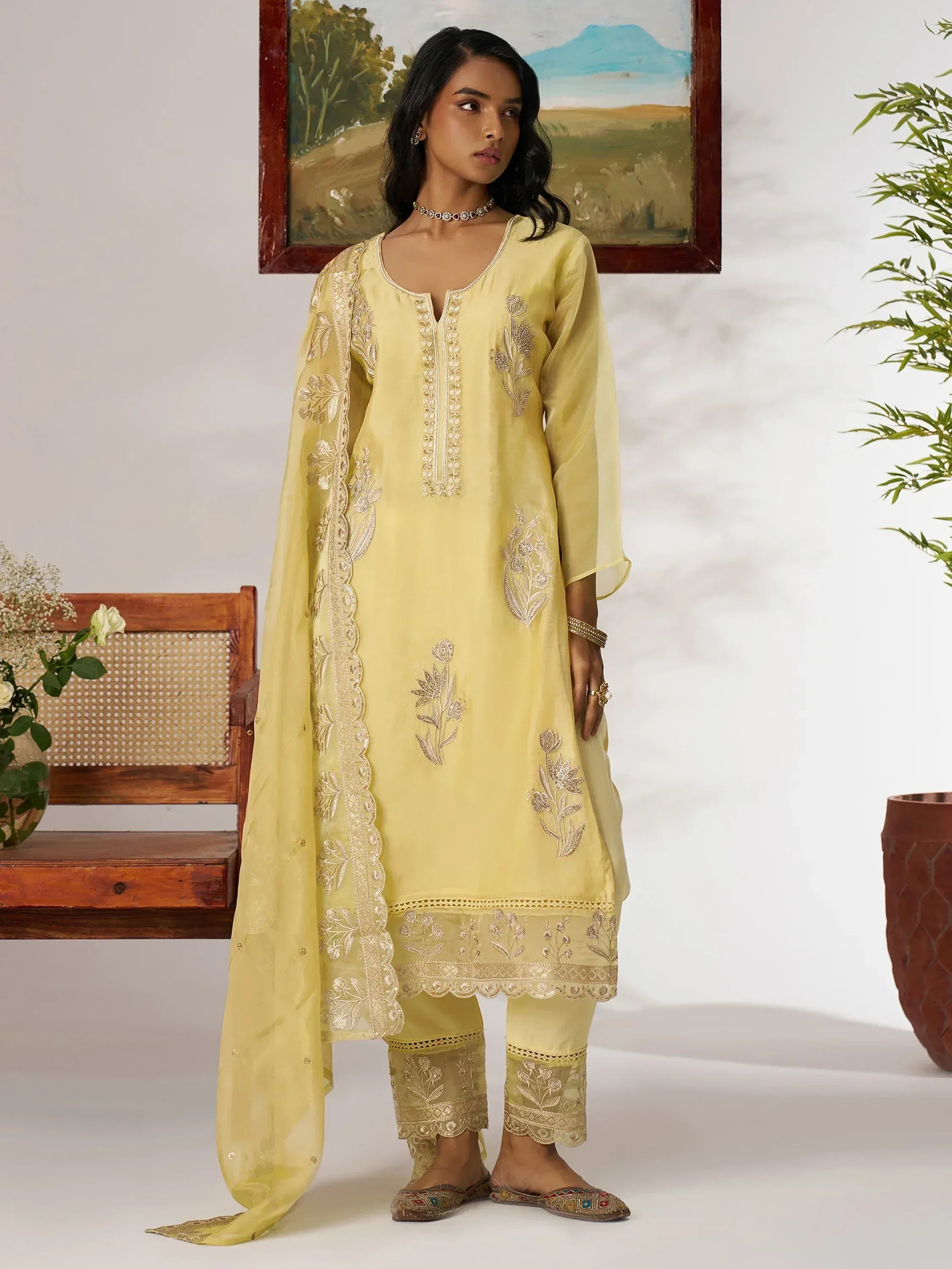 Yellow embroidered salwar kameez with floral detailing, perfect for ethnic wear and festive occasions.