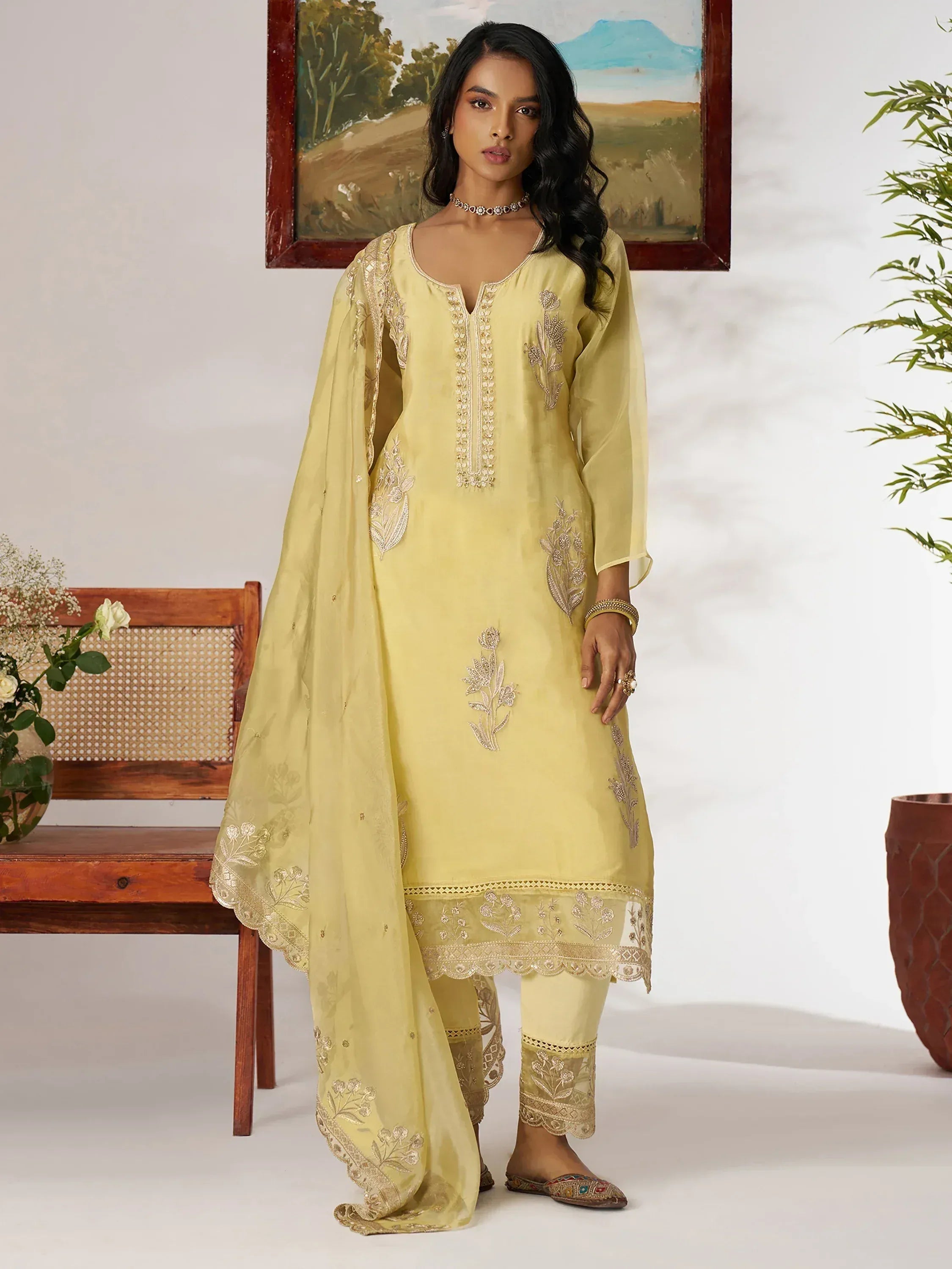 Yellow embroidered salwar kameez with floral detailing, perfect for Indian ethnic wear occasions