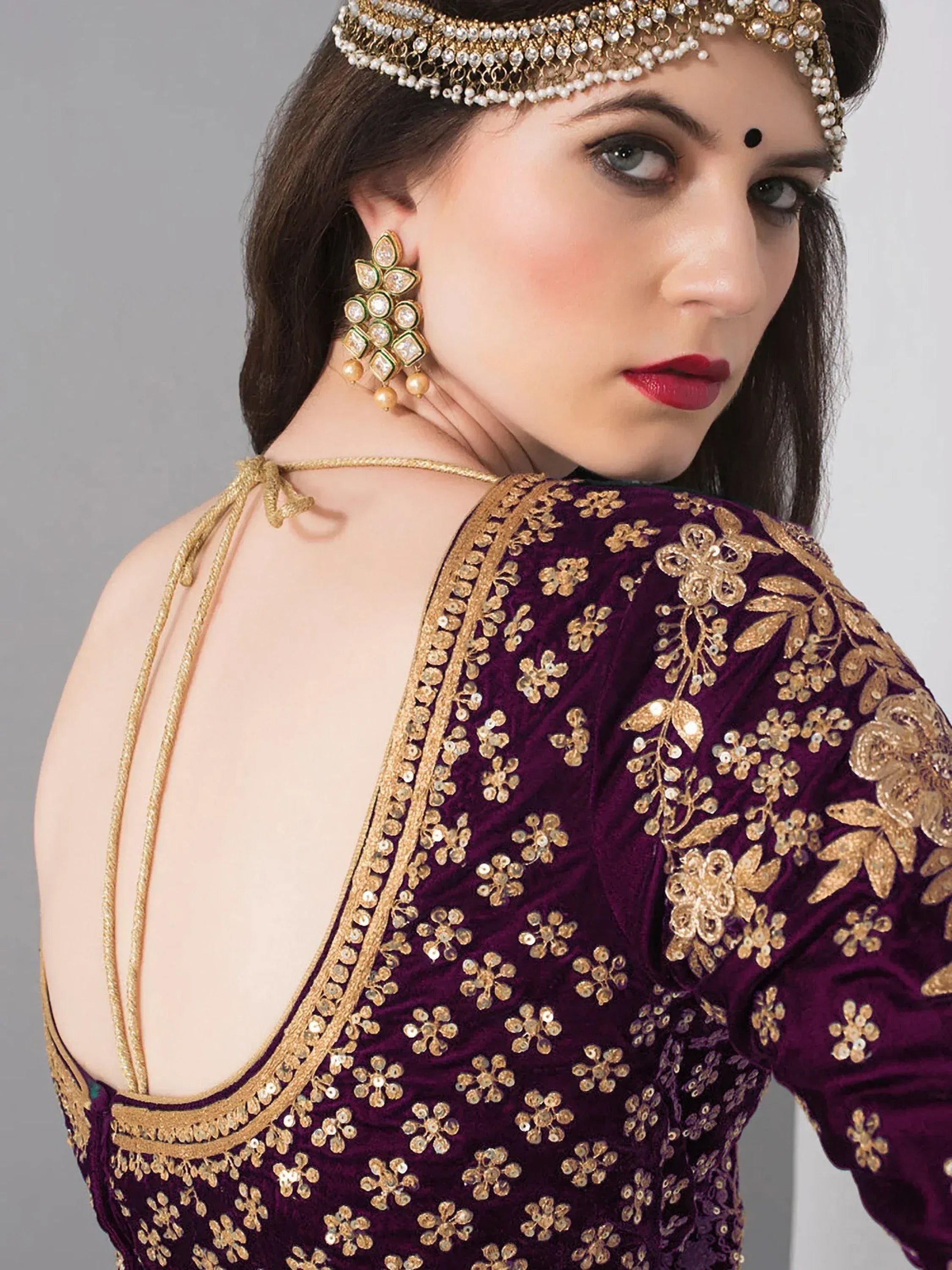 Purple velvet ethnic blouse with gold floral embroidery, back tie, and traditional jewelry