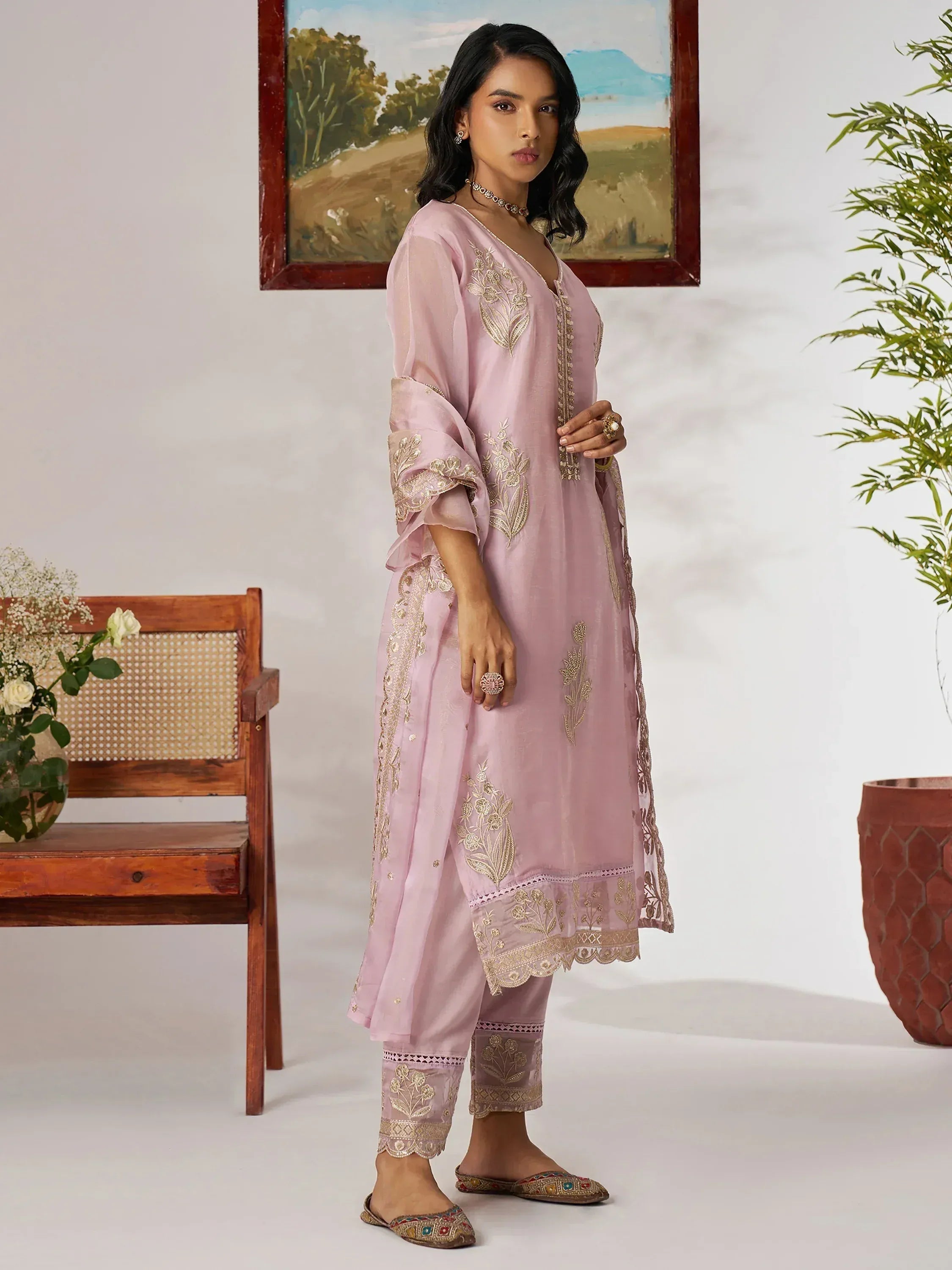 Pink embroidered salwar kameez with gold detailing, perfect for ethnic occasions and Indian wear