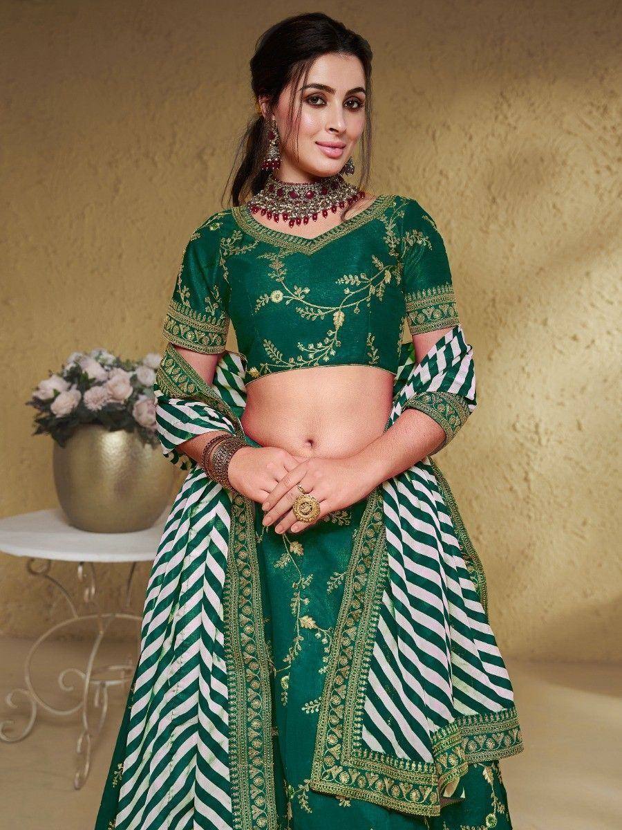 Green embroidered lehenga choli with white stripes, perfect for Indian ethnic wear and festive occasions