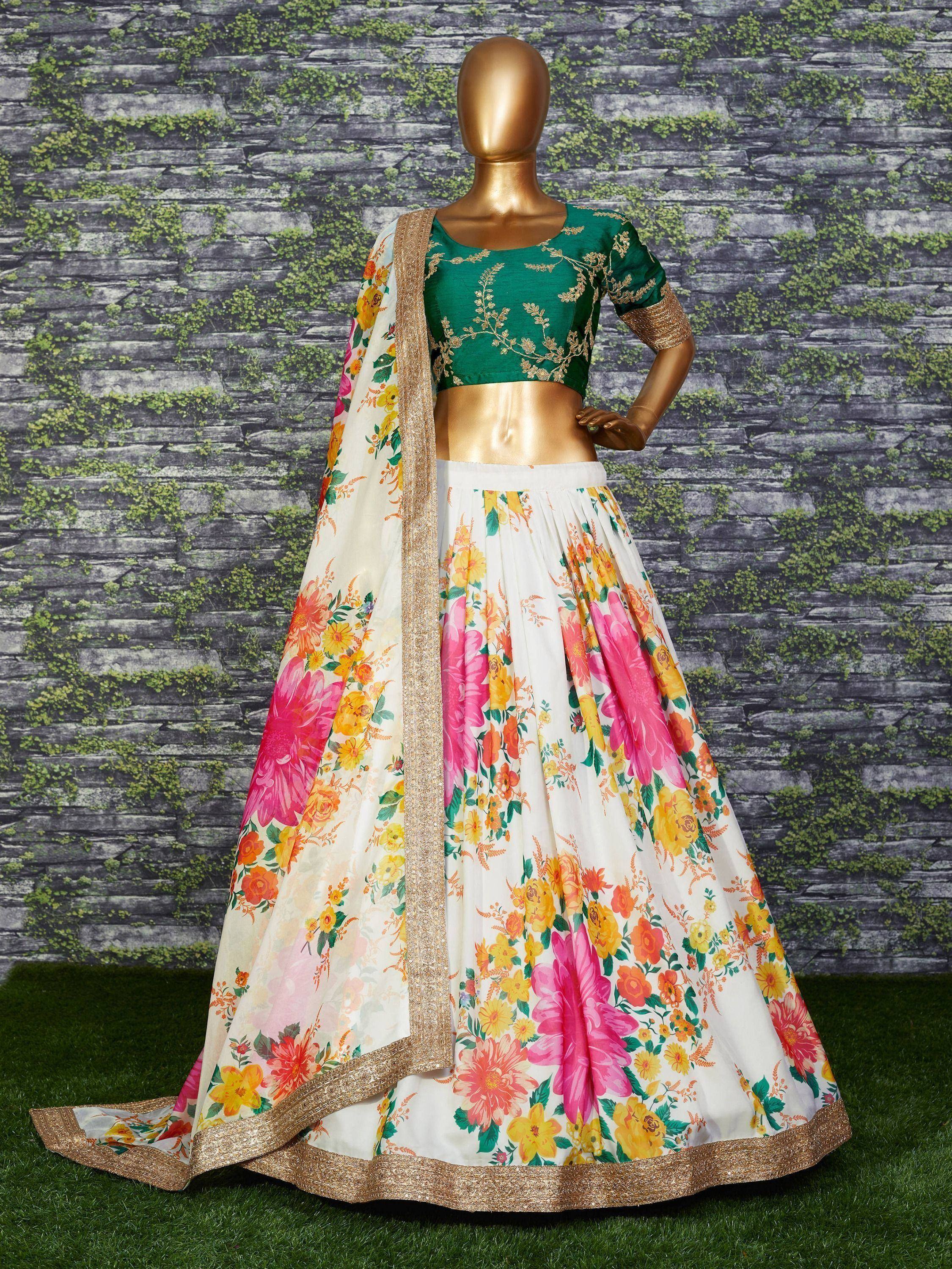 Floral print lehenga choli with green embroidered blouse and gold trim, ideal for Indian ethnic wear occasions