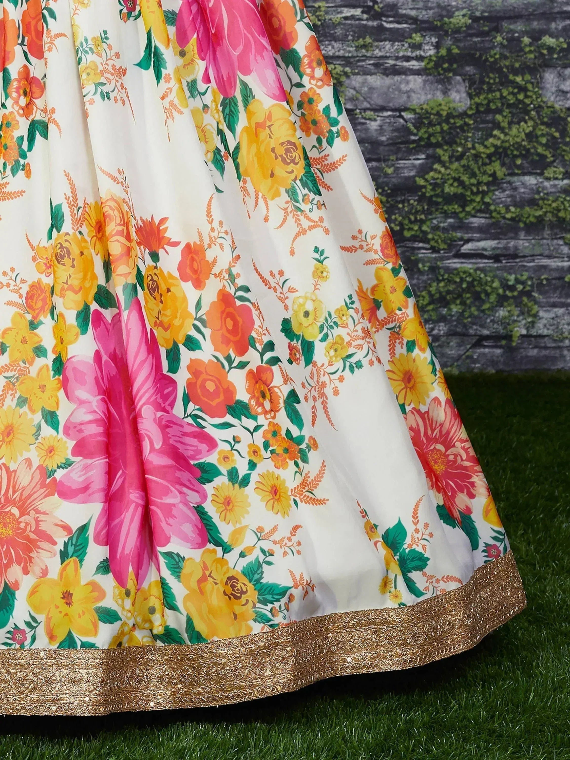 Floral print ethnic gown with gold border, vibrant yellow pink orange flowers on cream fabric