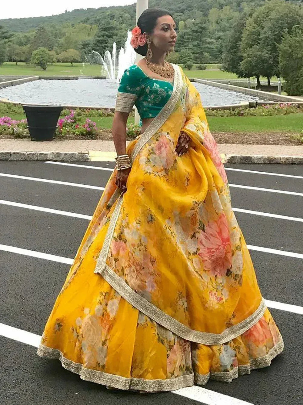 Yellow floral lehenga choli with green blouse, perfect for Indian weddings and festive occasions