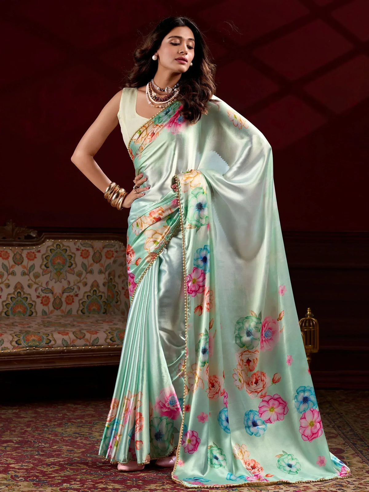 Mint green floral print saree with gold border, elegant Indian ethnic wear for women