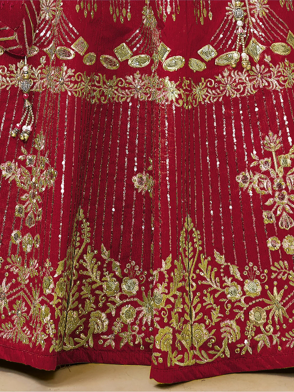 Red lehenga with gold embroidery, floral motifs, and dangling beads for Indian ethnic wear