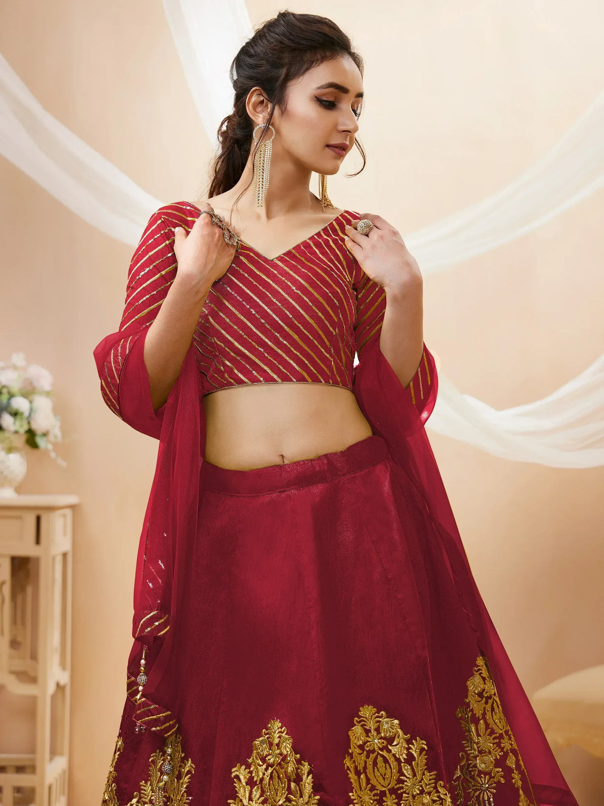 Maroon lehenga choli with gold embroidery and sheer dupatta for ethnic wear