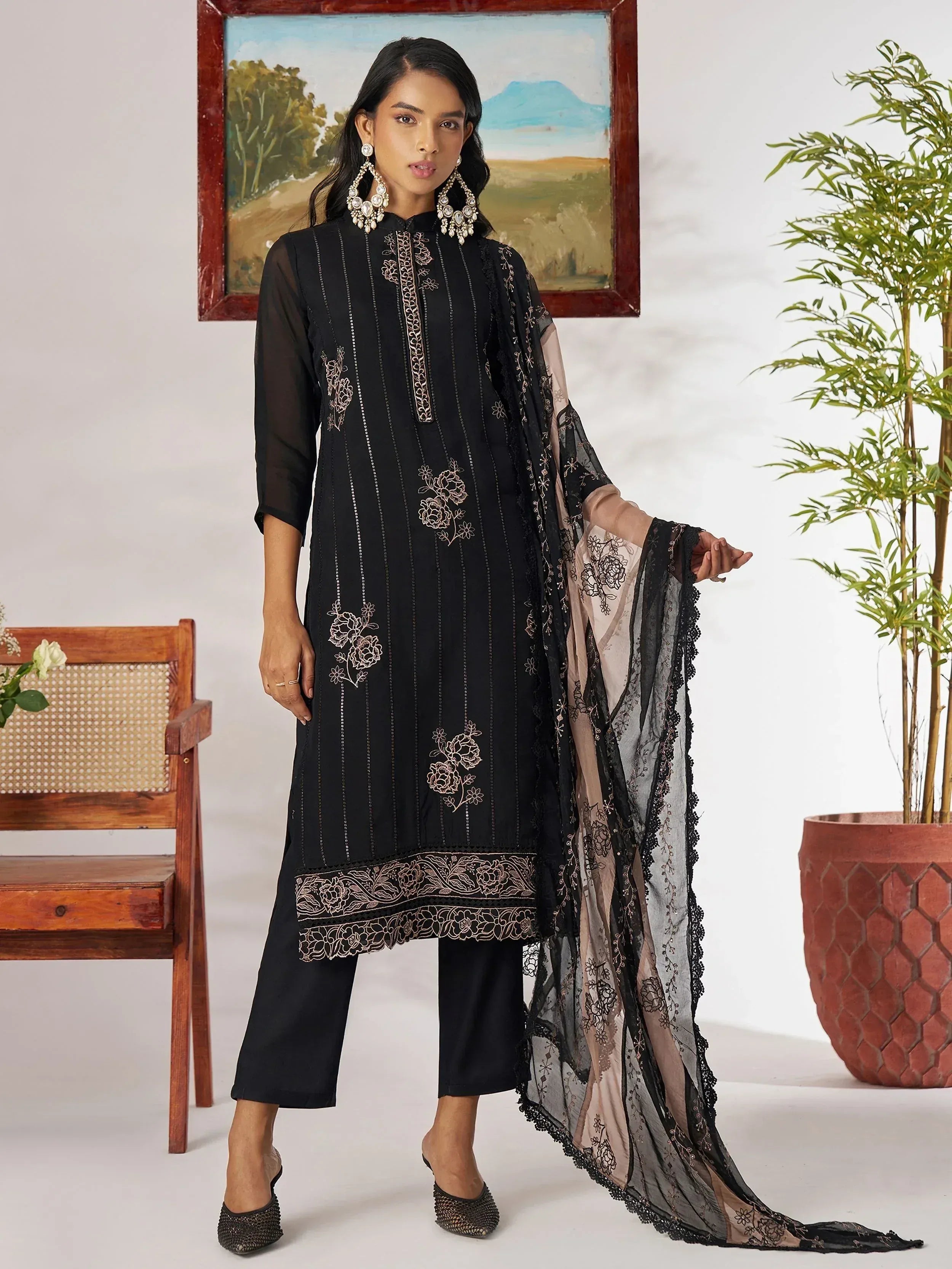 Black embroidered salwar kameez with floral detailing and sheer dupatta, ethnic wear for women
