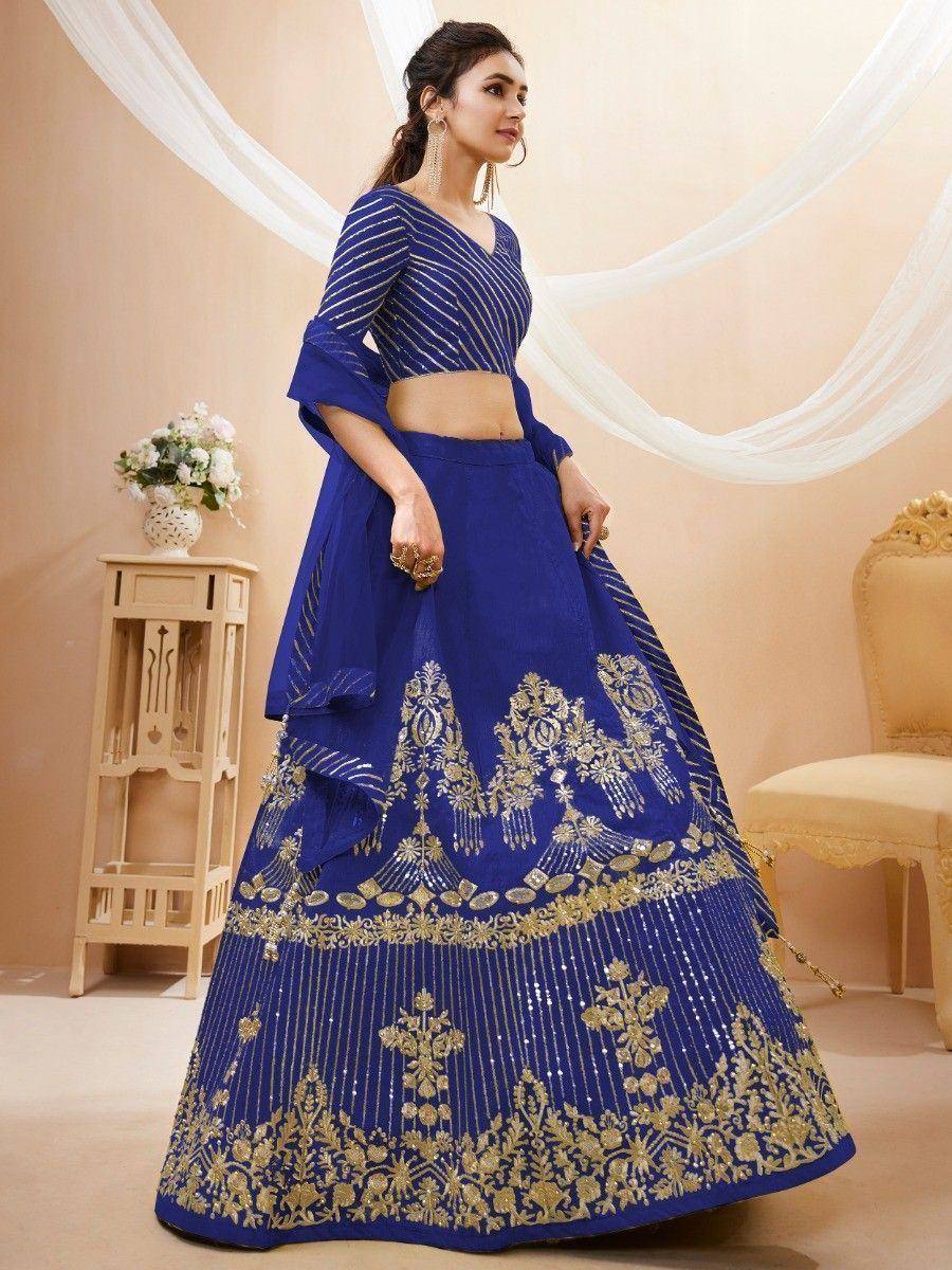Royal blue lehenga choli with gold embroidery, perfect for Indian weddings and festive occasions.