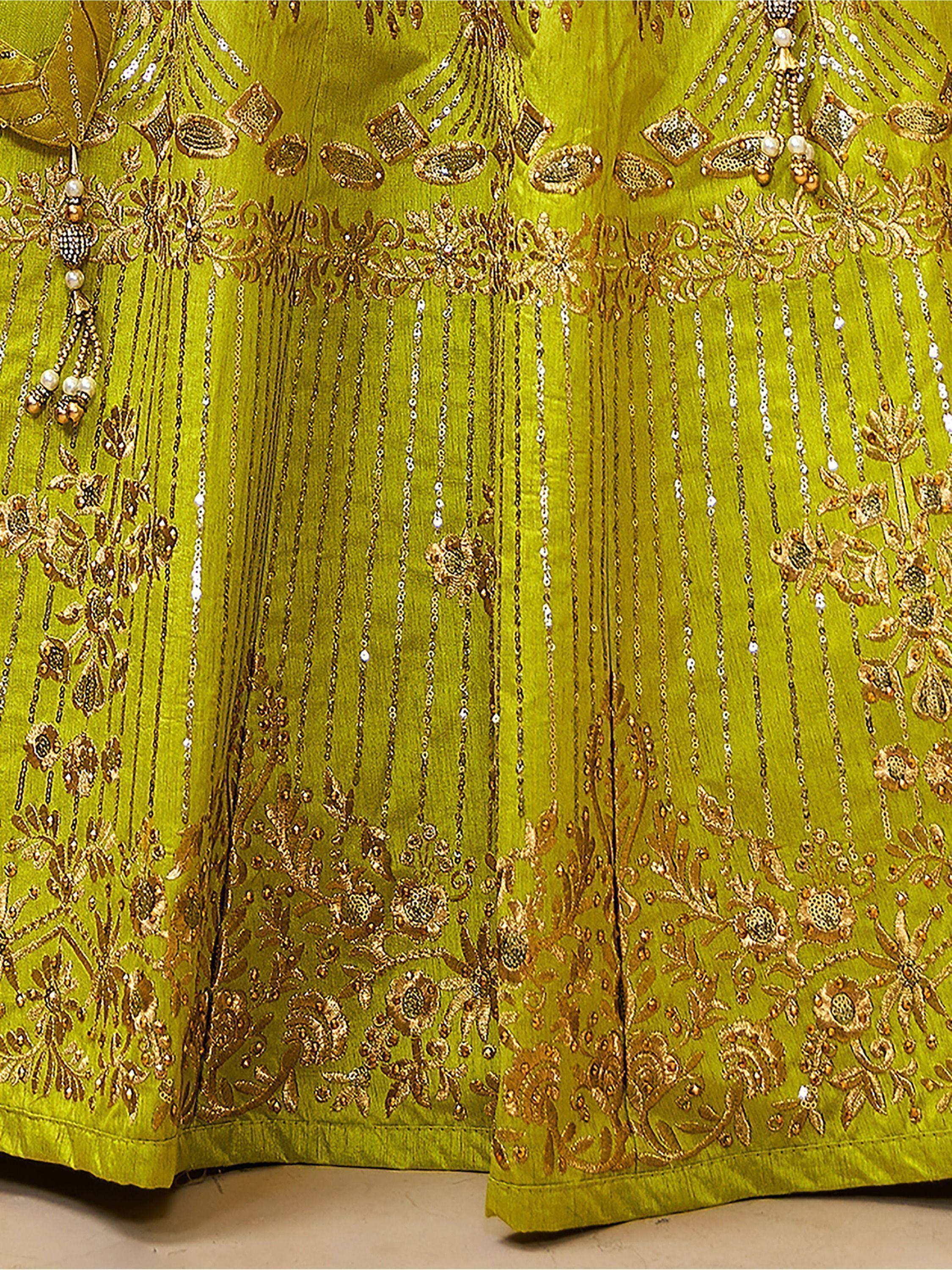 Lime green ethnic gown with gold embroidery, sequins, and pearl tassels for festive occasions