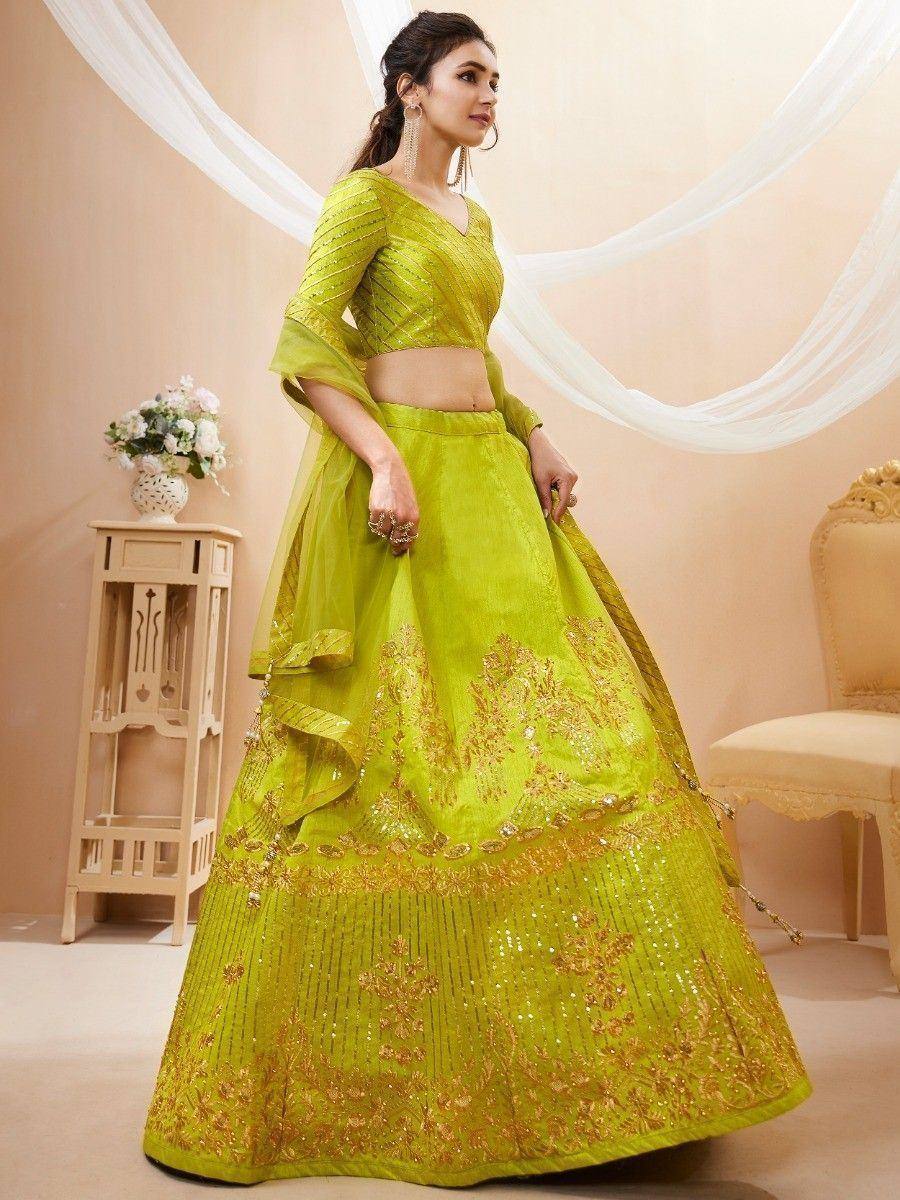 Lime green designer lehenga choli with gold embroidery and sequins, perfect for Indian ethnic wear events
