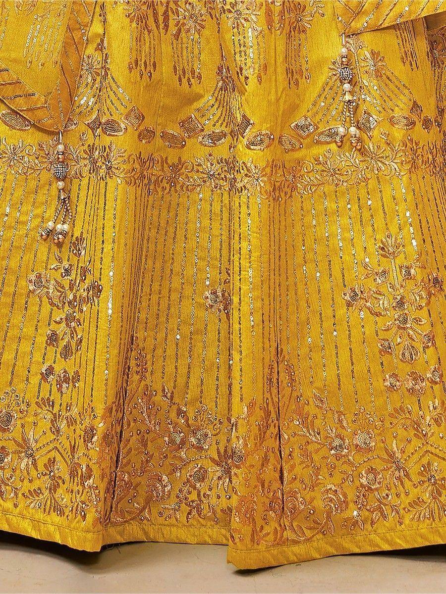 Golden embroidered lehenga with intricate floral motifs and sequin detailing, perfect for Indian ethnic wear.