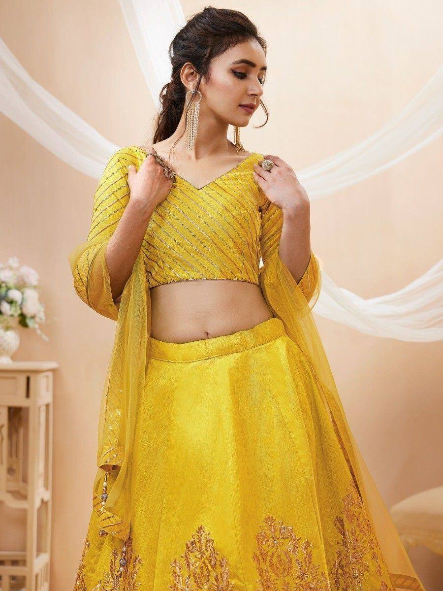 Yellow designer lehenga choli with gold embroidery, perfect for Indian ethnic wear occasions