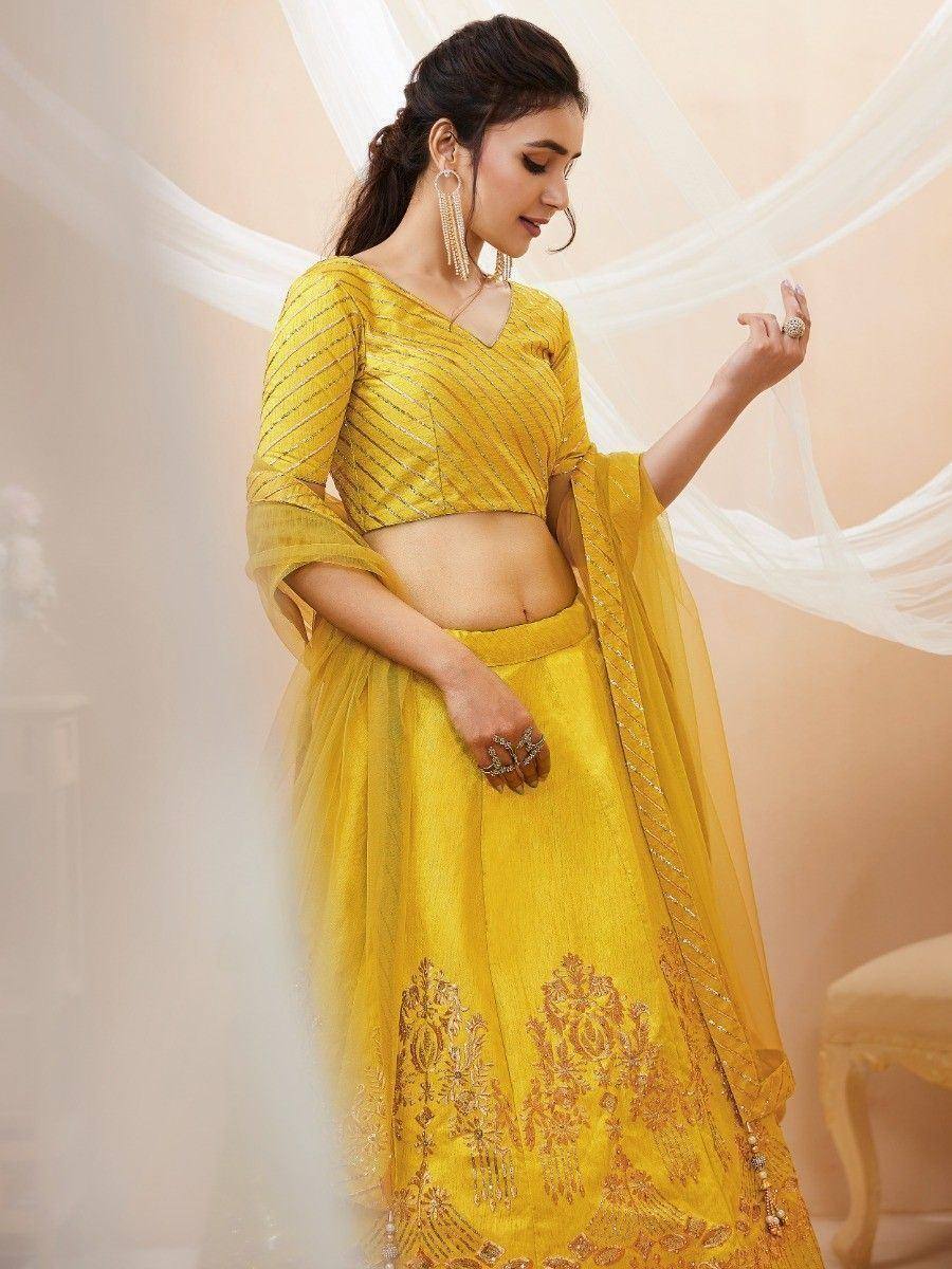 Yellow embroidered lehenga choli with sheer dupatta, perfect for Indian ethnic wear occasions