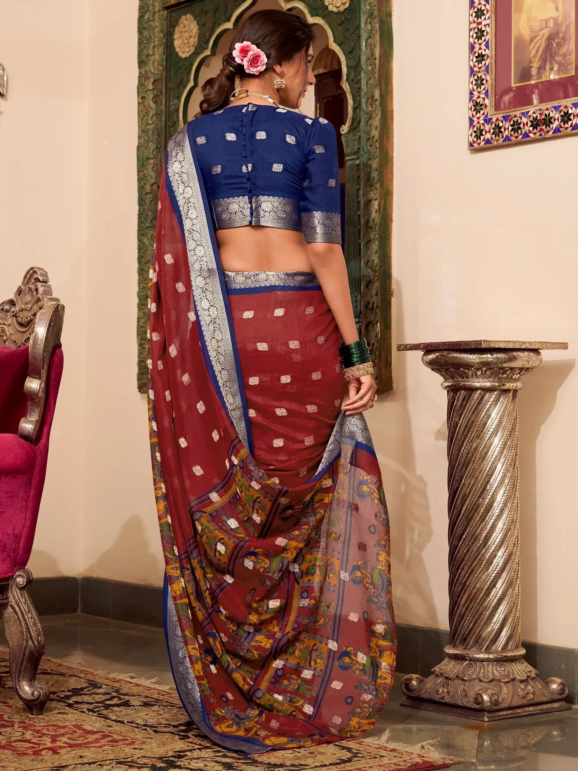 Woman in maroon and blue printed saree with silver border, ethnic wear for festive occasions