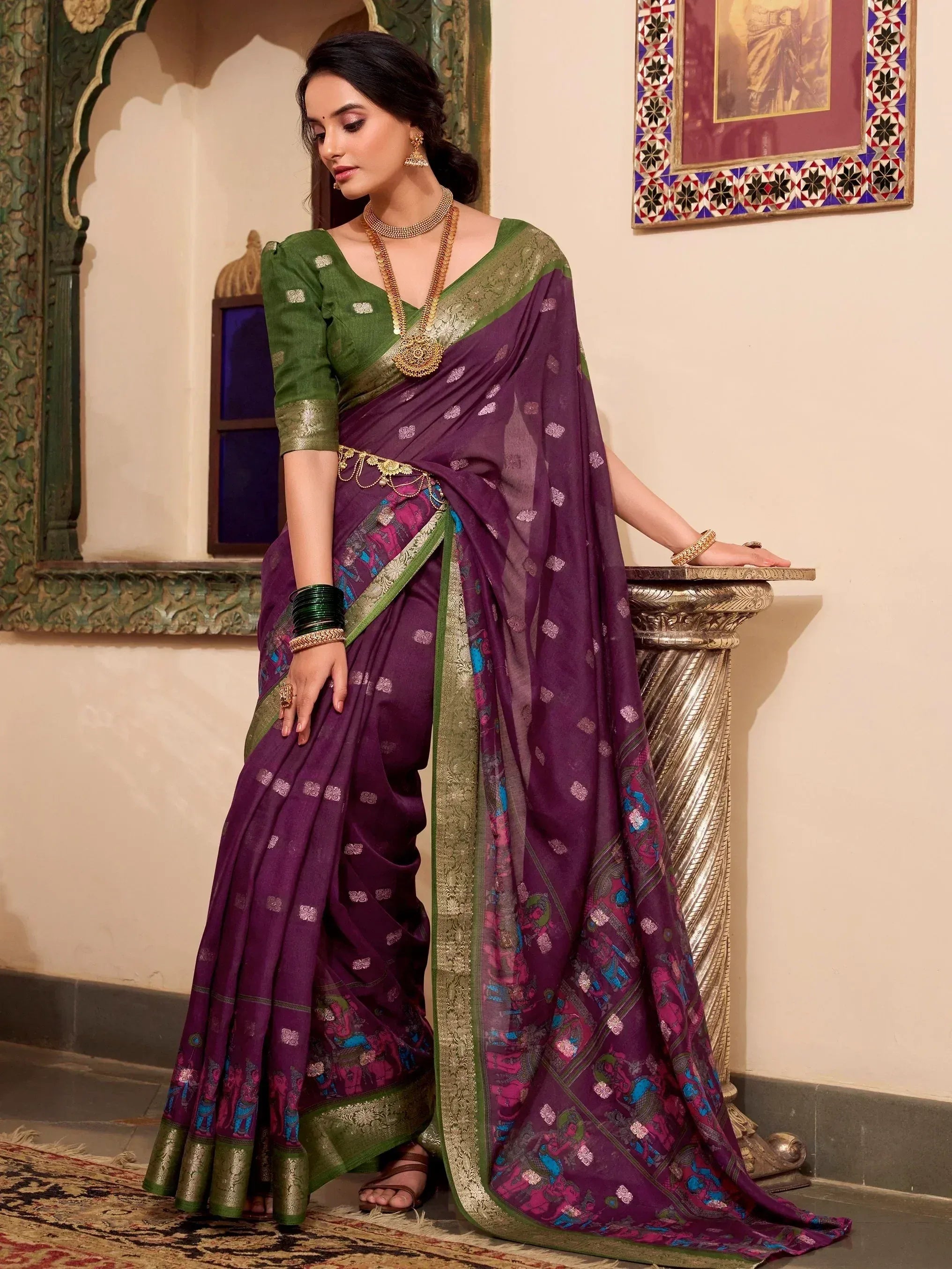 Purple and green designer saree with elephant print, gold border, and matching blouse for Indian ethnic wear