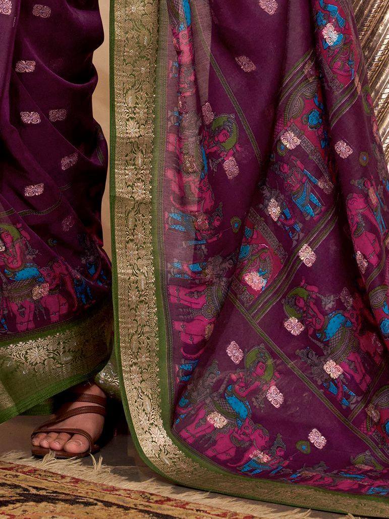 Purple ethnic saree with intricate temple print, gold border, and floral motifs, paired with sandals