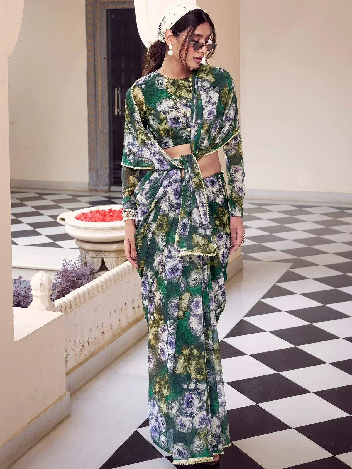 Green floral print ethnic saree with crop top and pearl trim, styled with headscarf and sunglasses