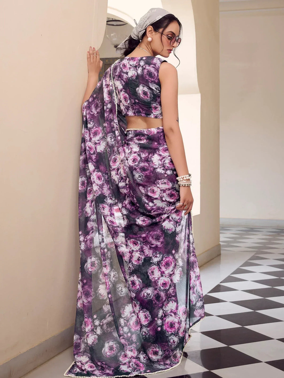 Purple floral print saree with pearl border, styled with crop top and headscarf for ethnic wear