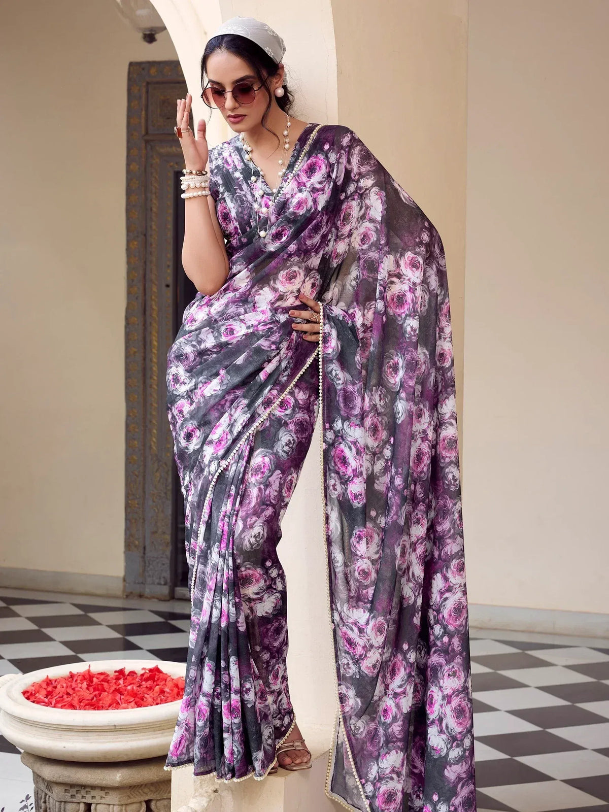 Purple floral print saree with pearl border, styled with pearl jewelry and headscarf for ethnic wear